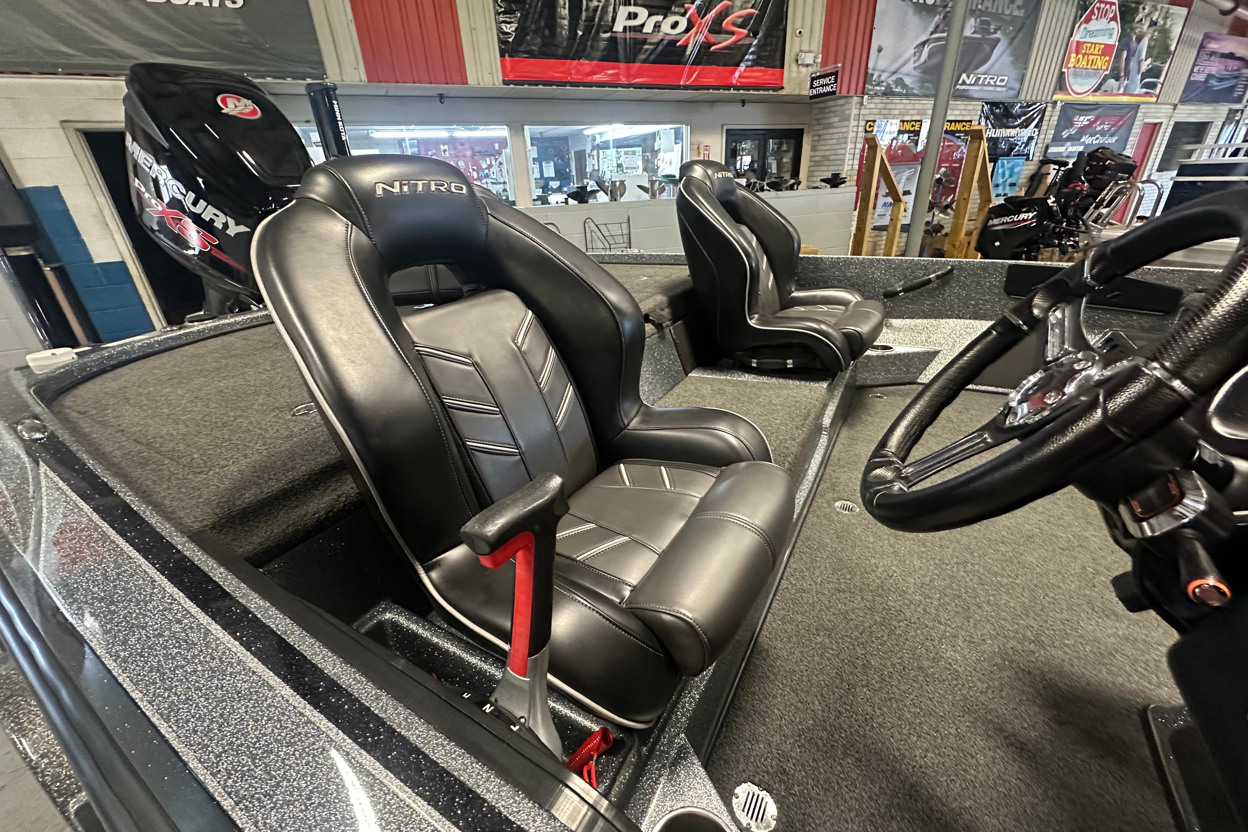 2018 Nitro Z20 Pro boat interior with black leather seats and steering wheel.
