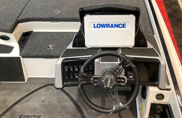 2025 Triton 20XP boat dashboard with Lowrance display and steering wheel.
