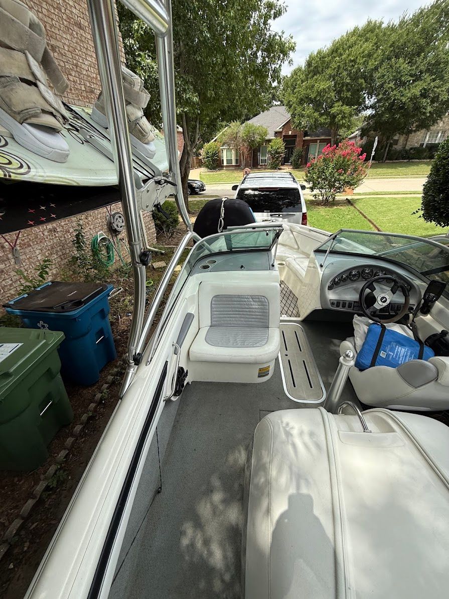 The image shows the interior of a 1999 MasterCraft Prostar 205, parked in a driveway.