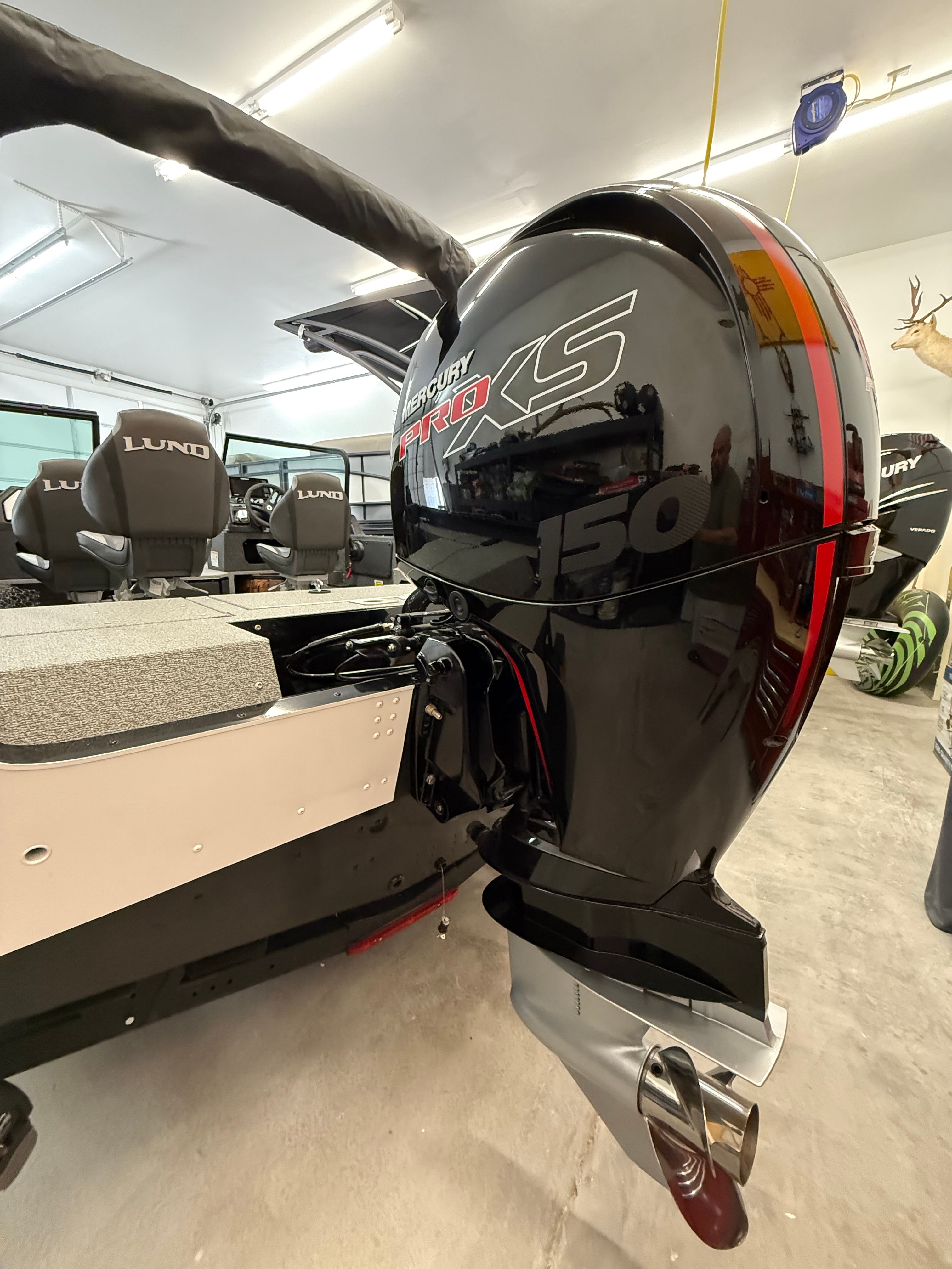 A Mercury Pro XS outboard motor on a 2025 Lund 1875 Impact XS Sport boat.