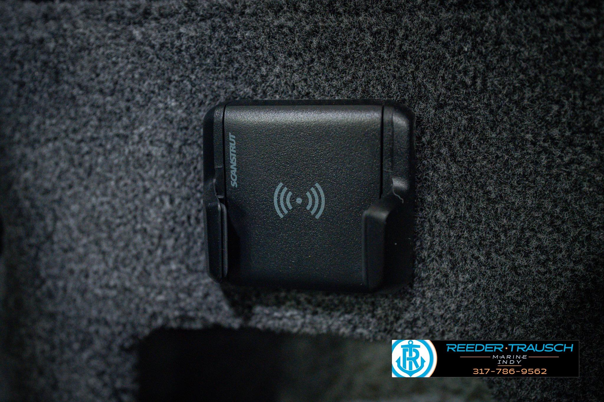 Wireless charging pad in 2026 Lund 1775 Impact XS boat interior.