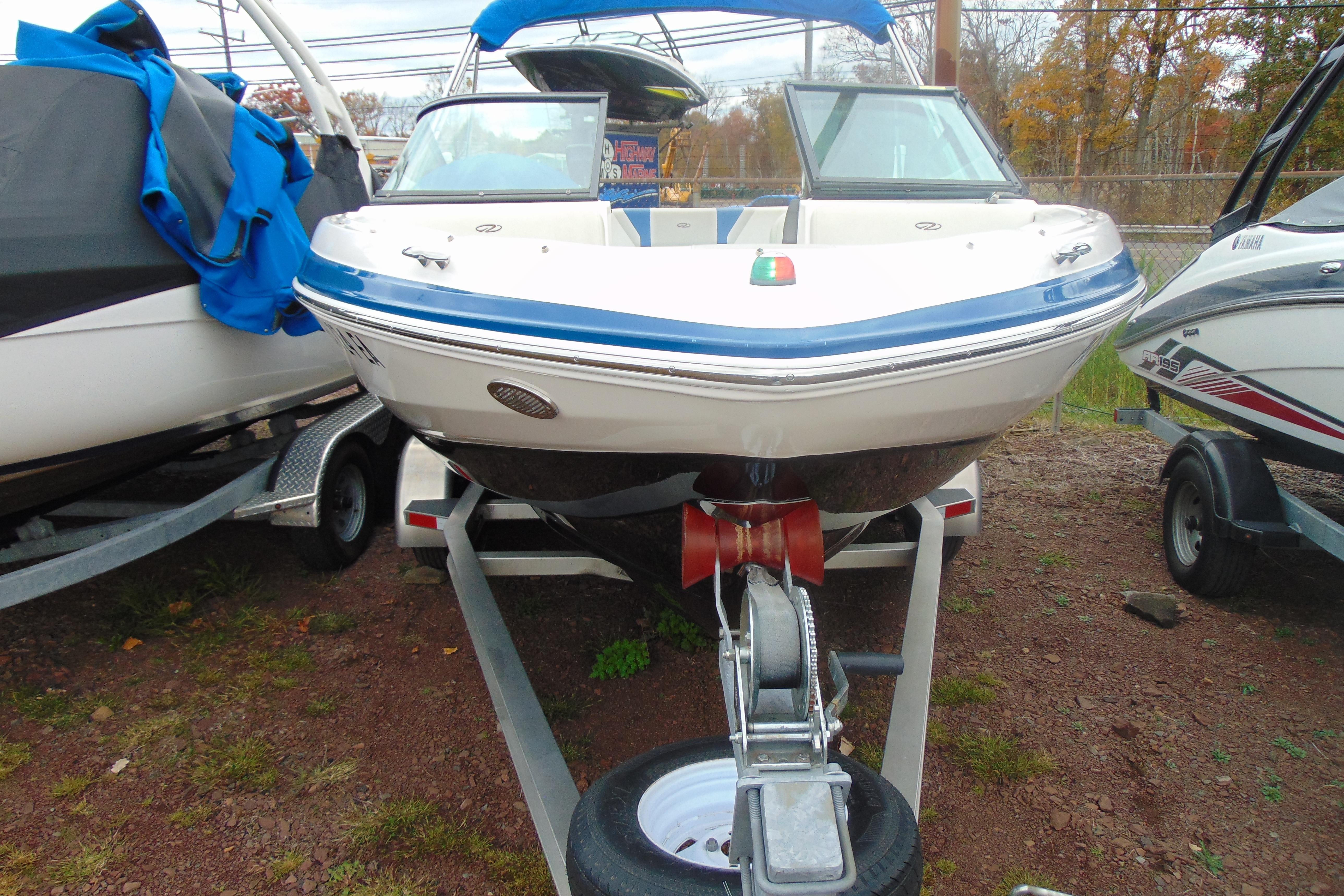 2016 Regal 2000 ESX Bowrider on trailer, front view, parked outdoors.