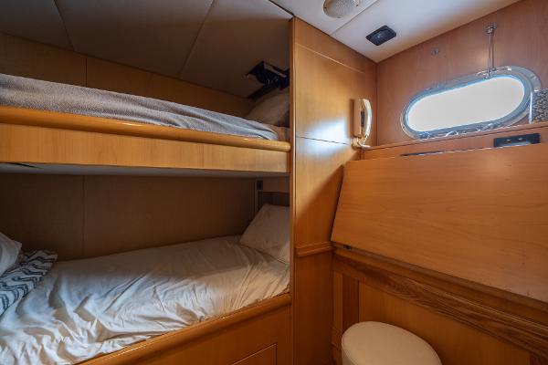 2001 Grand Harbour 76 yacht cabin with bunk beds and porthole window.