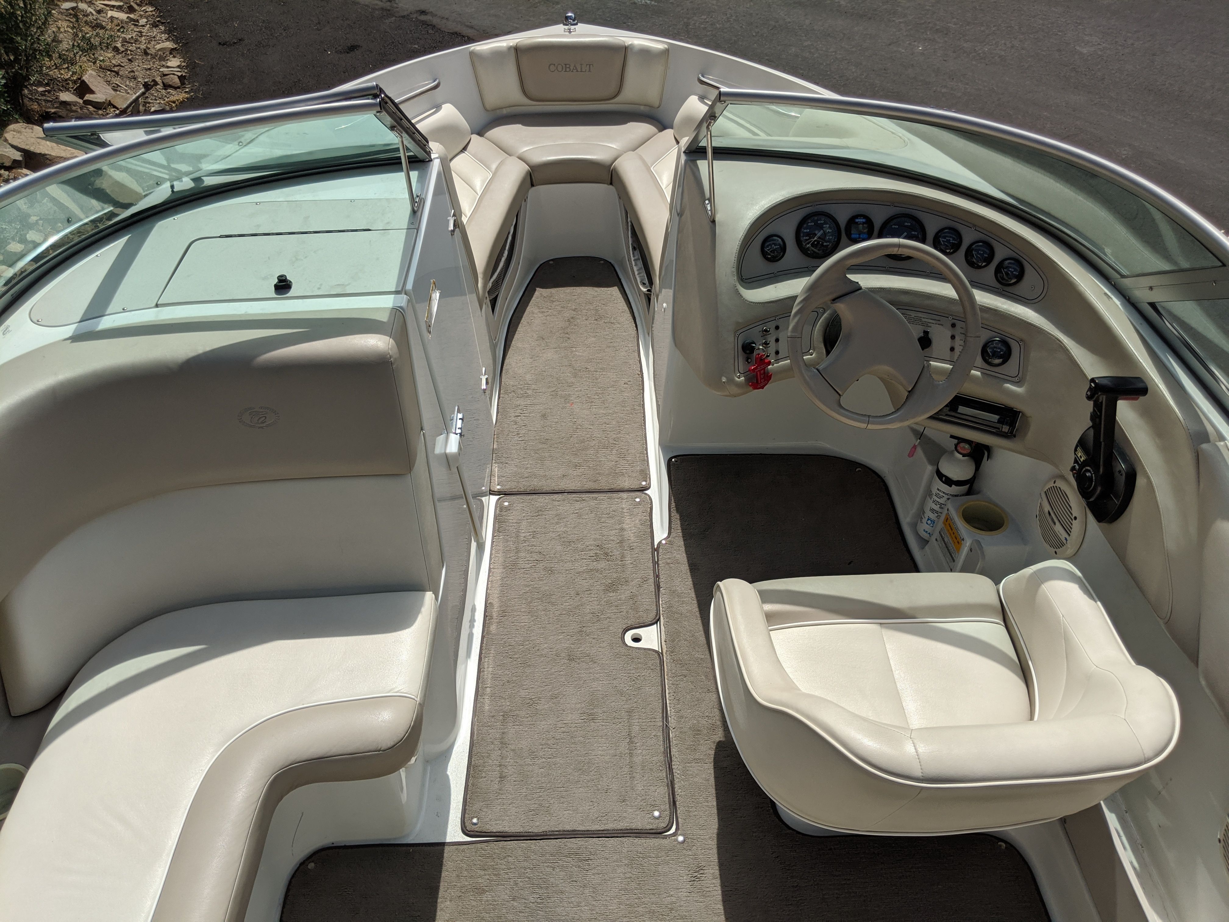 Interior view of a 1997 Cobalt 190 boat with beige seating and dashboard.