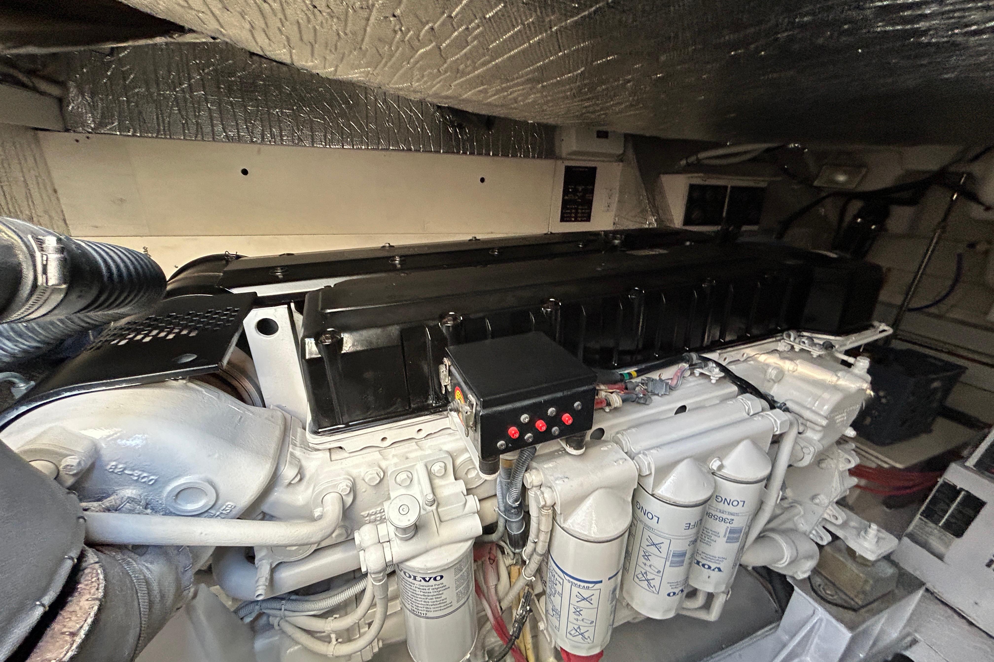 Engine room of 2003 Cruisers Yachts 540 Express, showcasing detailed mechanical components.