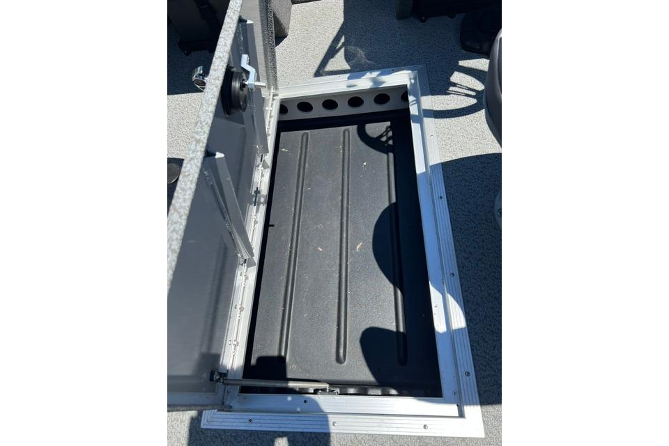 Open storage compartment in 2023 Starweld Fusion 18 DC boat, showcasing interior design.