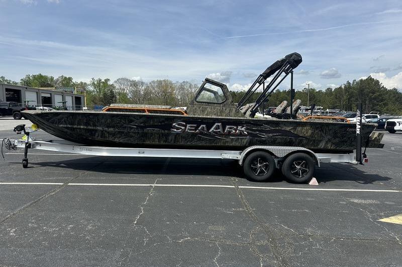 2026 SeaArk EasyCat boat on trailer in parking lot, side view.