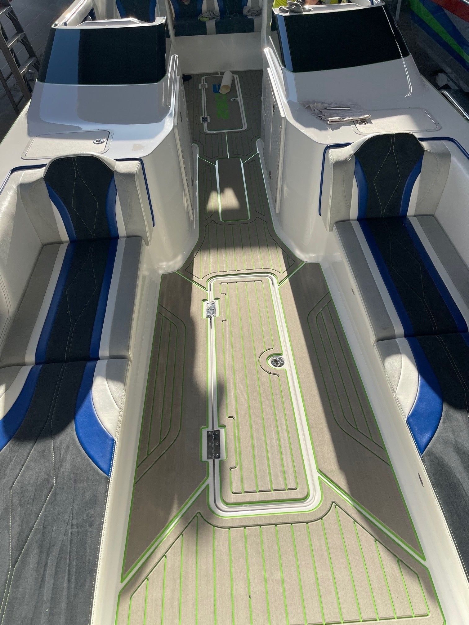 Interior of a 2021 Custom Barron 290s boat with blue and gray seating.