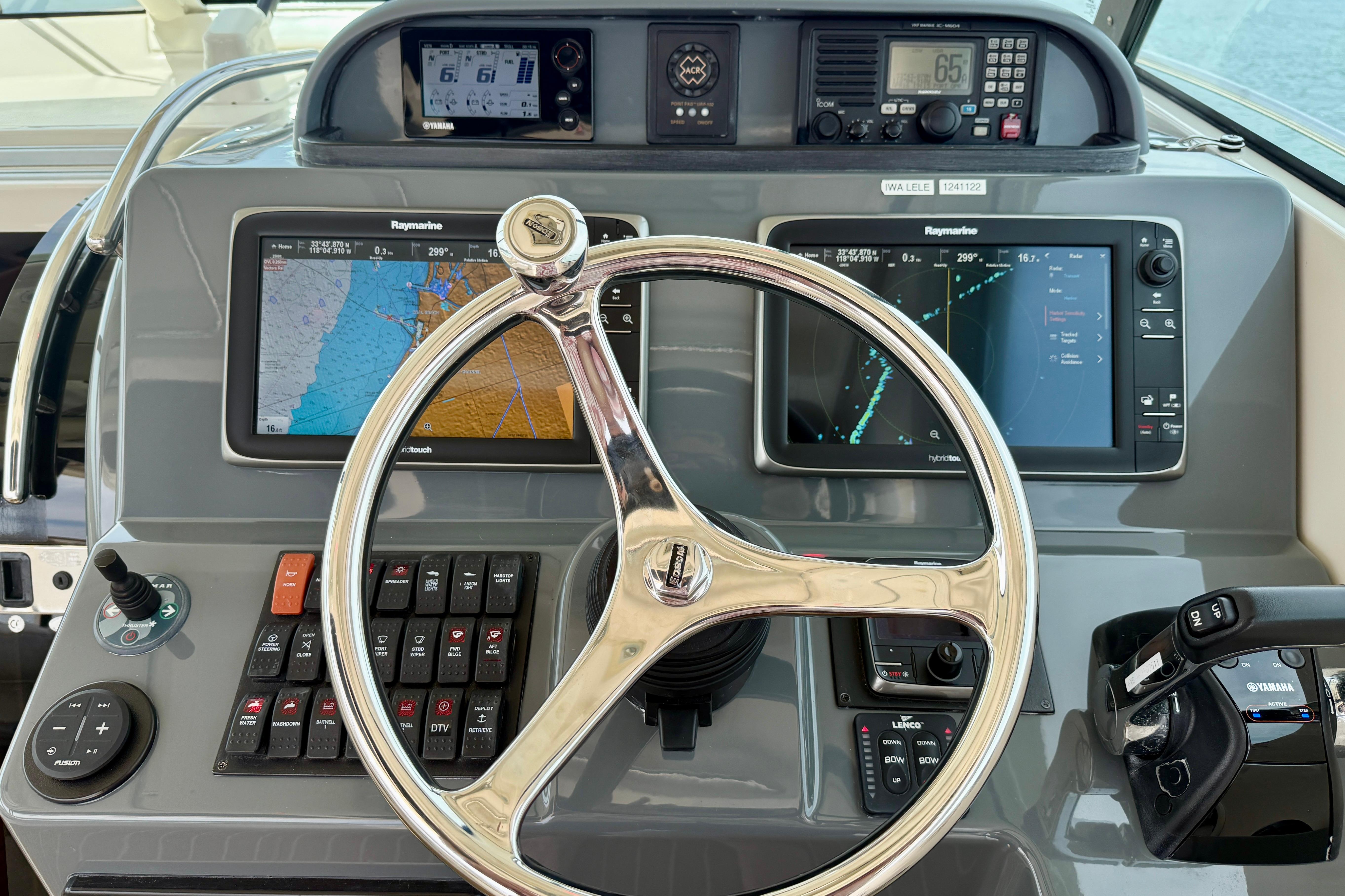 2012 Pursuit OS 345 Offshore helm with navigation screens and controls.