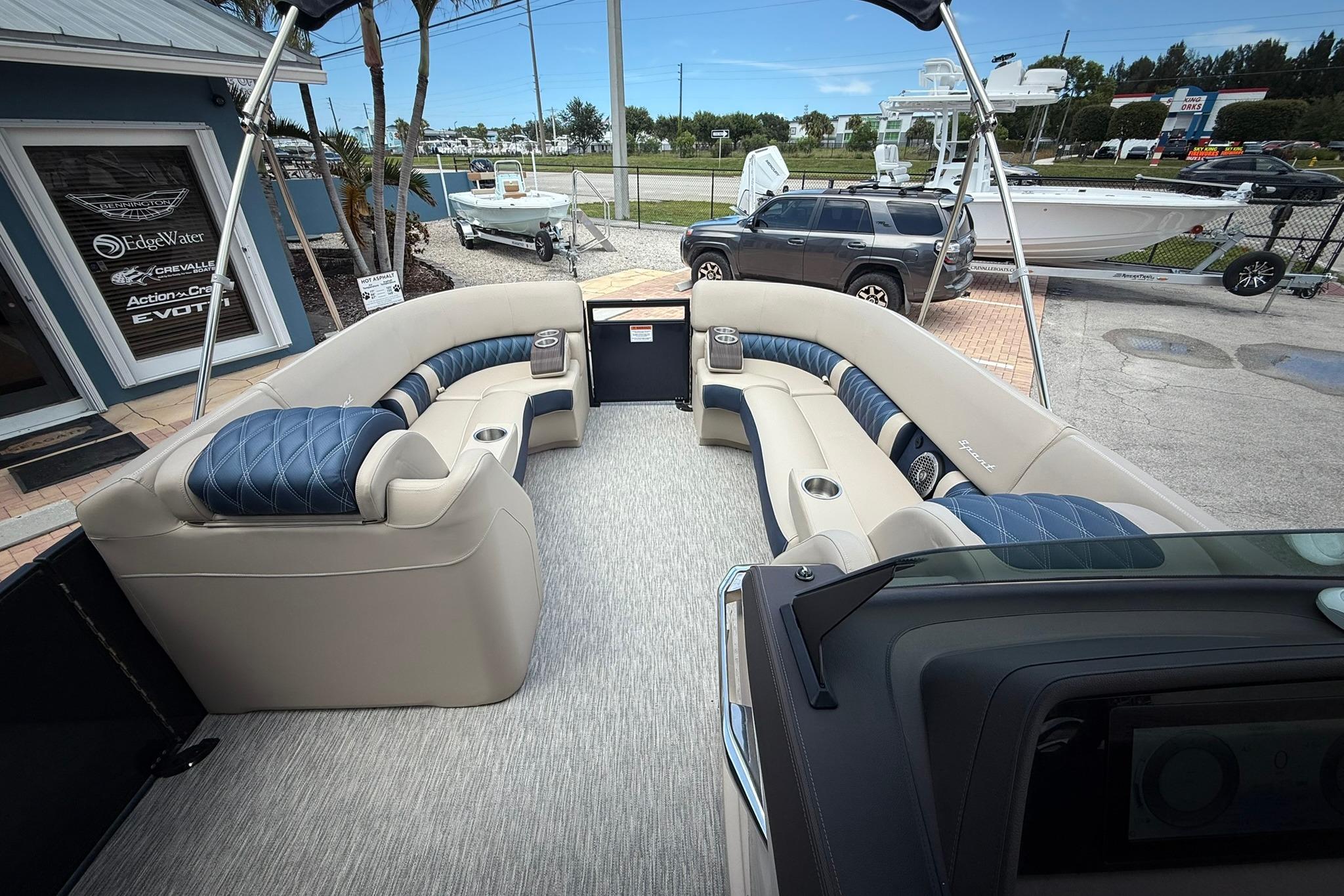 Luxurious interior of 2026 Bennington 27 QSBAT2 pontoon boat with plush seating.