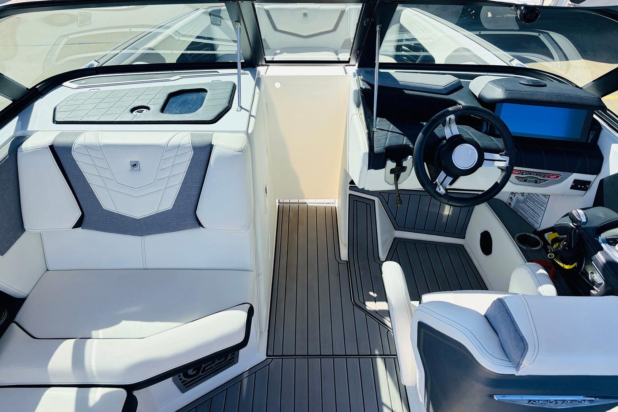 2023 Nautique Super Air Nautique G25 interior with sleek seating and modern dashboard design.