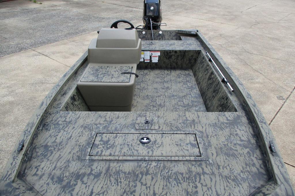 2026 Tracker GRIZZLY® 1648 SC boat interior with camouflage design and steering console.