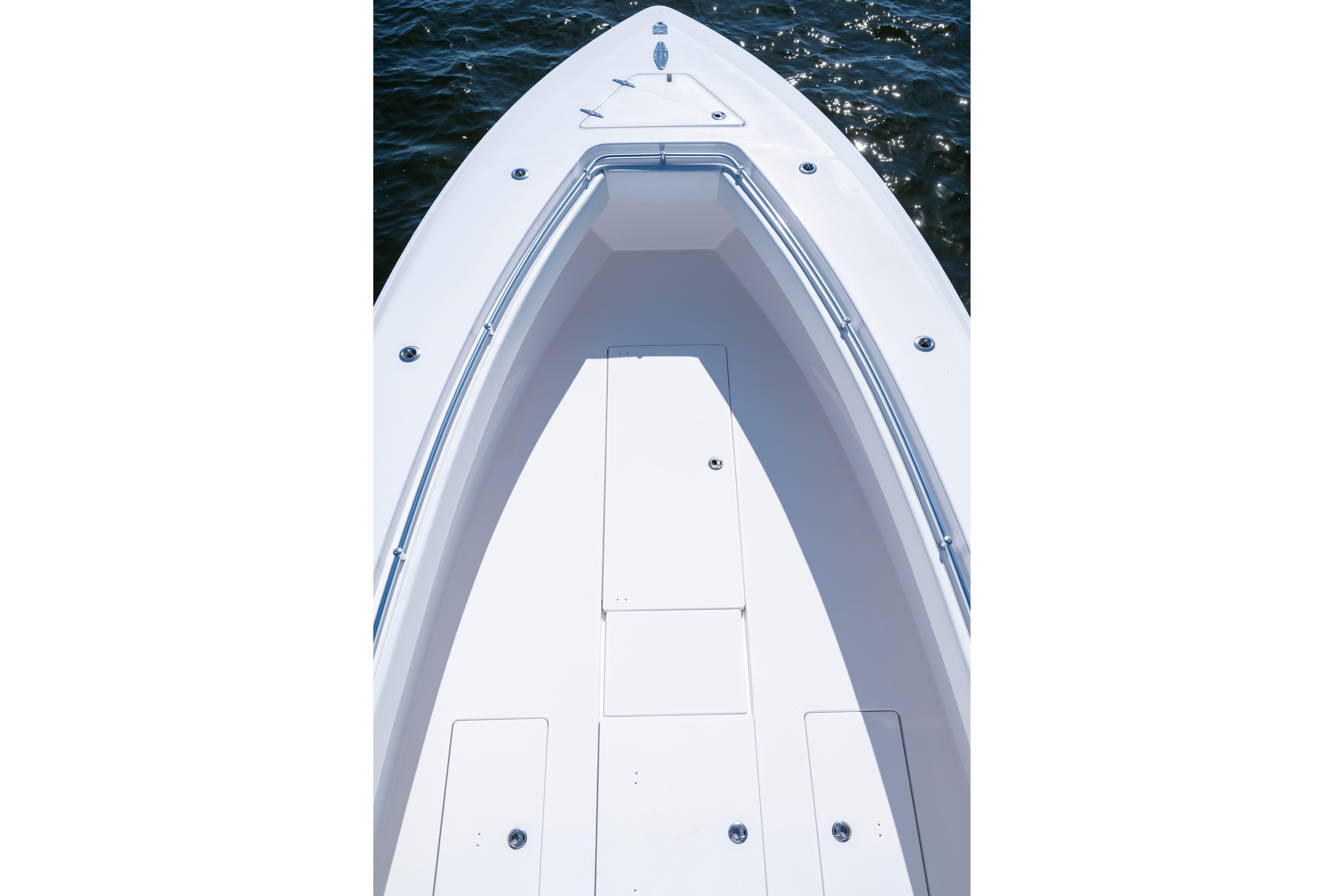 2015 Contender 39 ST boat deck with sleek white finish on water.
