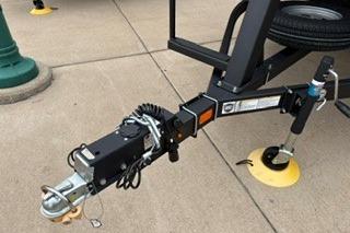 2026 Sun Tracker Party Barge 22 XP3 trailer hitch on concrete surface.