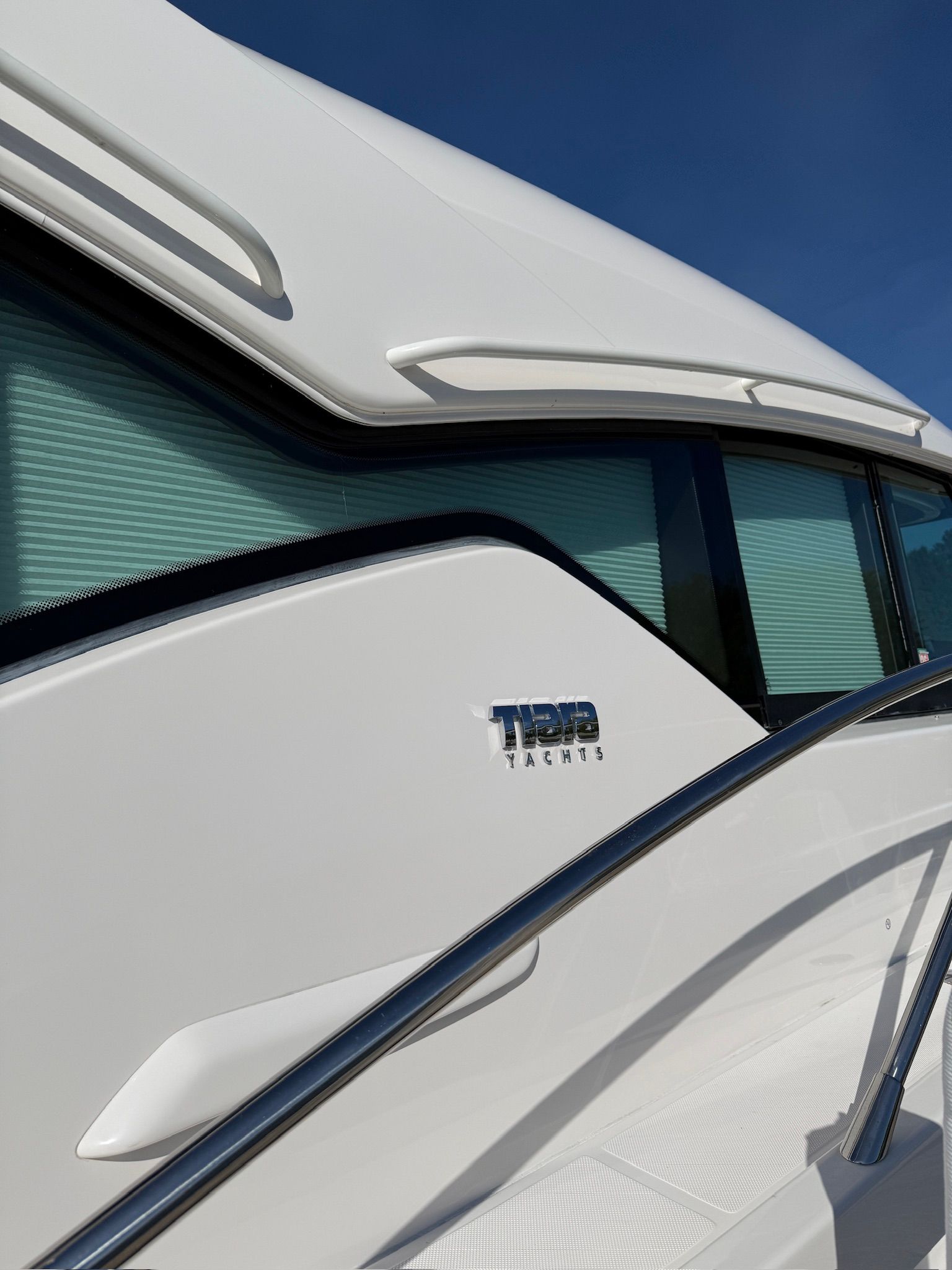 Close-up of the 2017 Tiara Yachts C44 Coupe, featuring sleek design and shiny details.