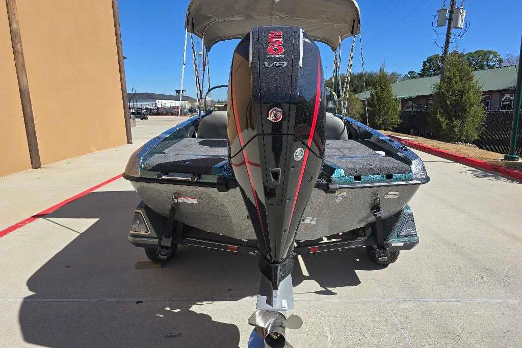 2026 Ranger 212LS boat with powerful V8 engine, parked outdoors on a sunny day.