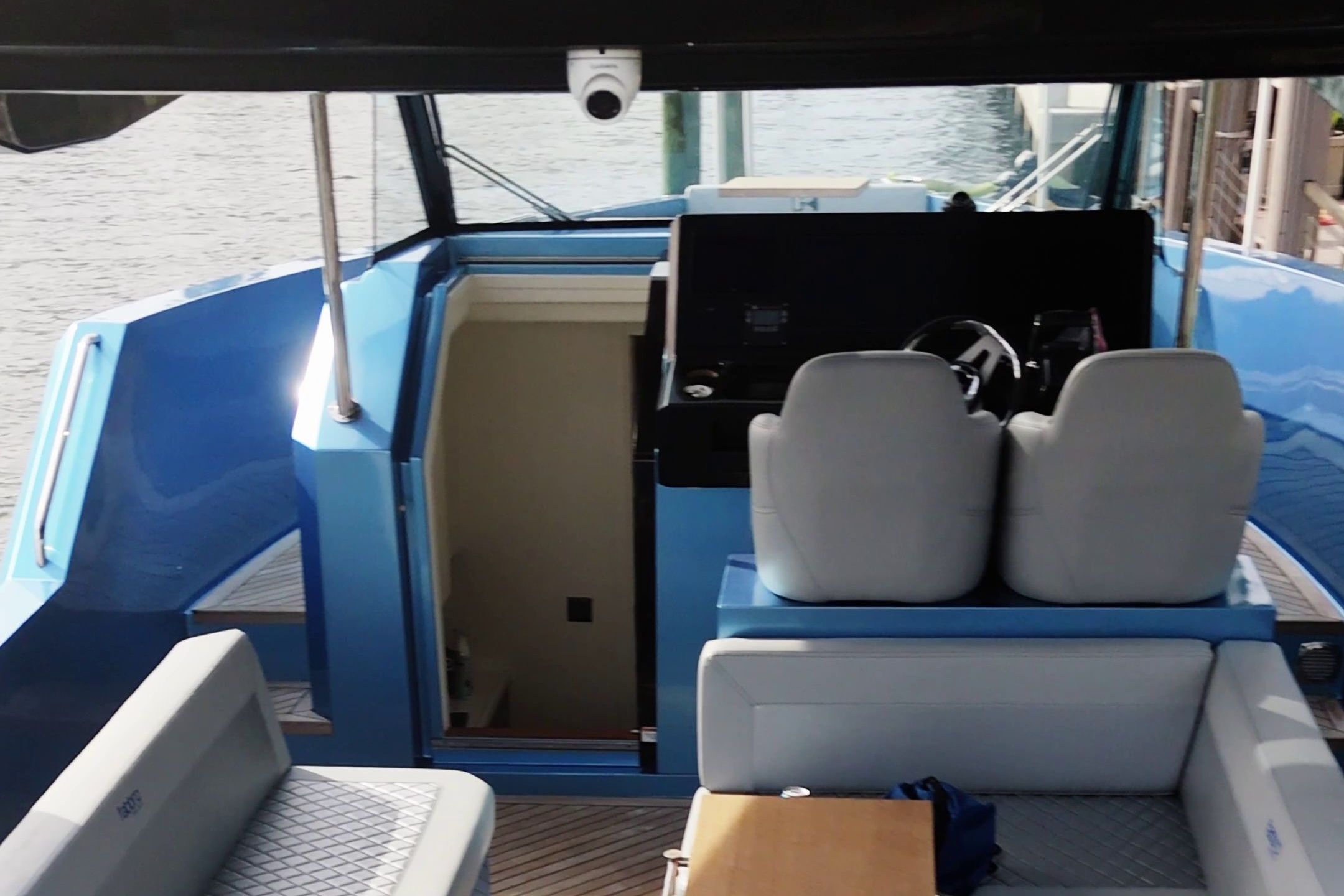 The image shows the cockpit of a 2025 Fabbro F45 Cabrio Outboard with gray seating.