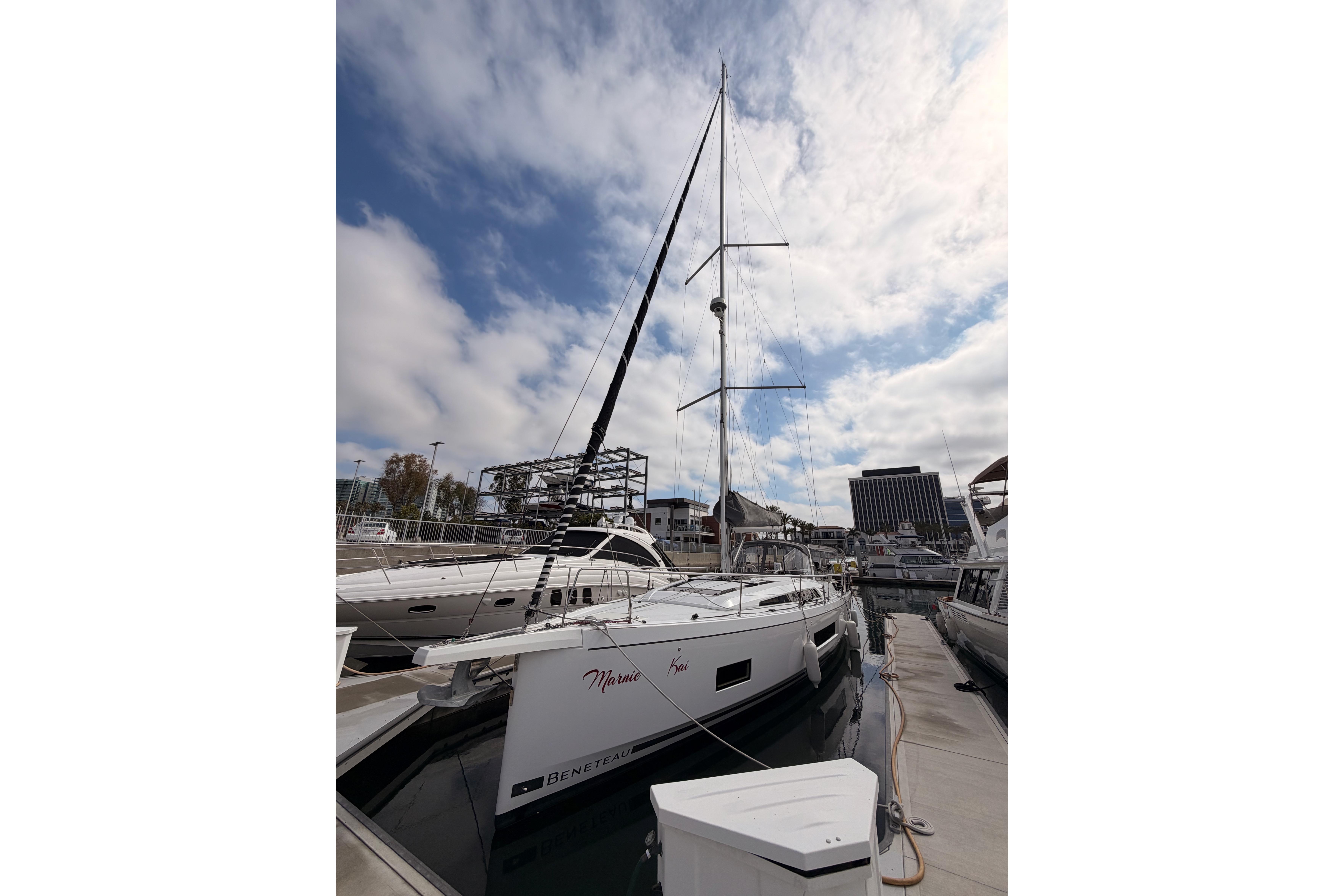 2020 Beneteau Oceanis 46.1 yacht docked under a partly cloudy sky.