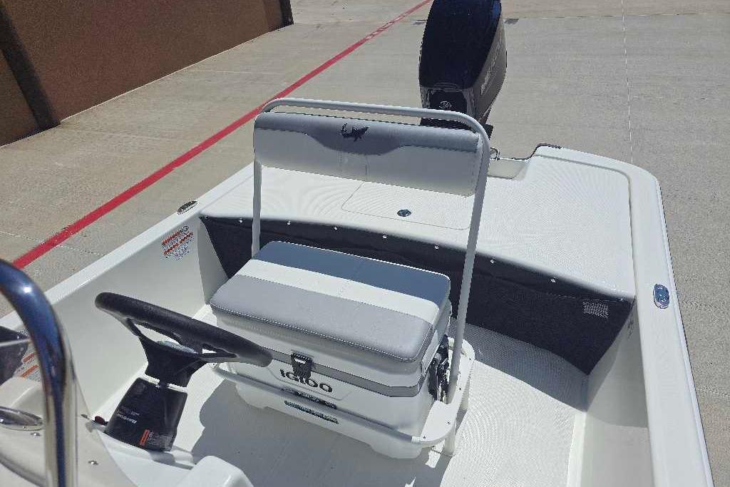2026 Mako Pro Skiff 17 CC boat interior with steering wheel and seating.