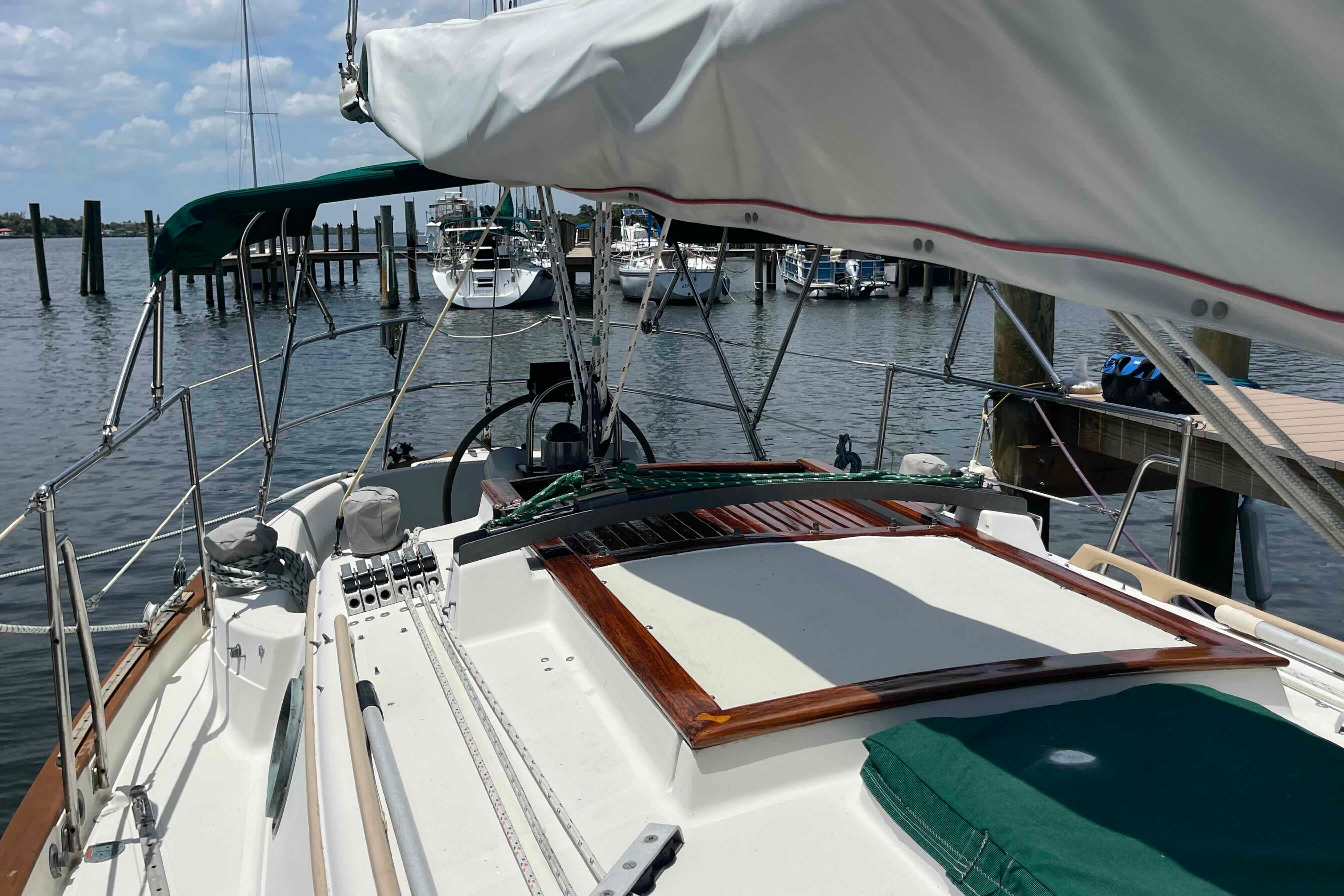 1987 Pacific Seacraft 34 sailboat docked at a marina, showcasing deck and rigging.