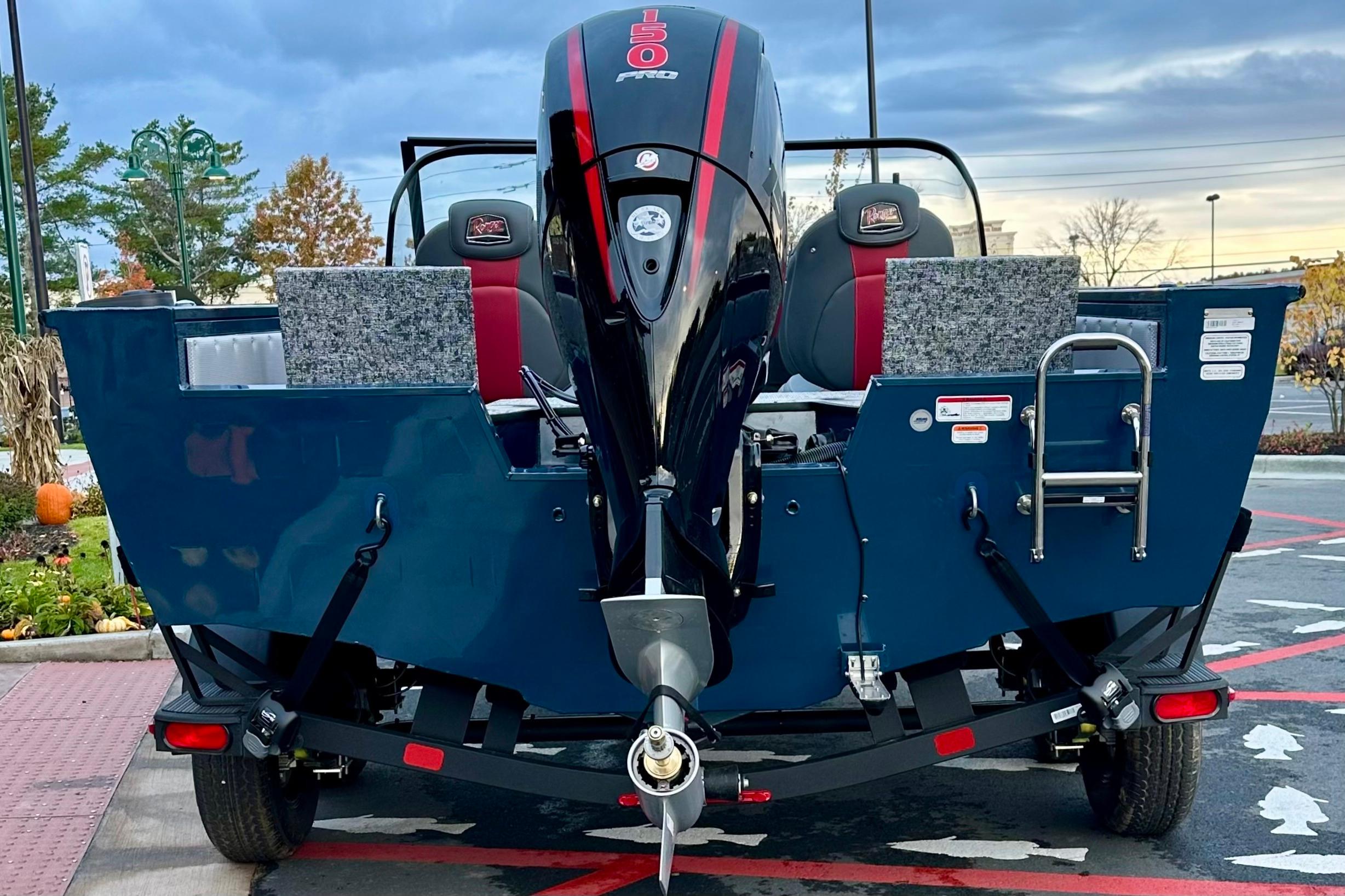 2026 Ranger VX1788 WT boat with powerful outboard motor, parked outdoors.