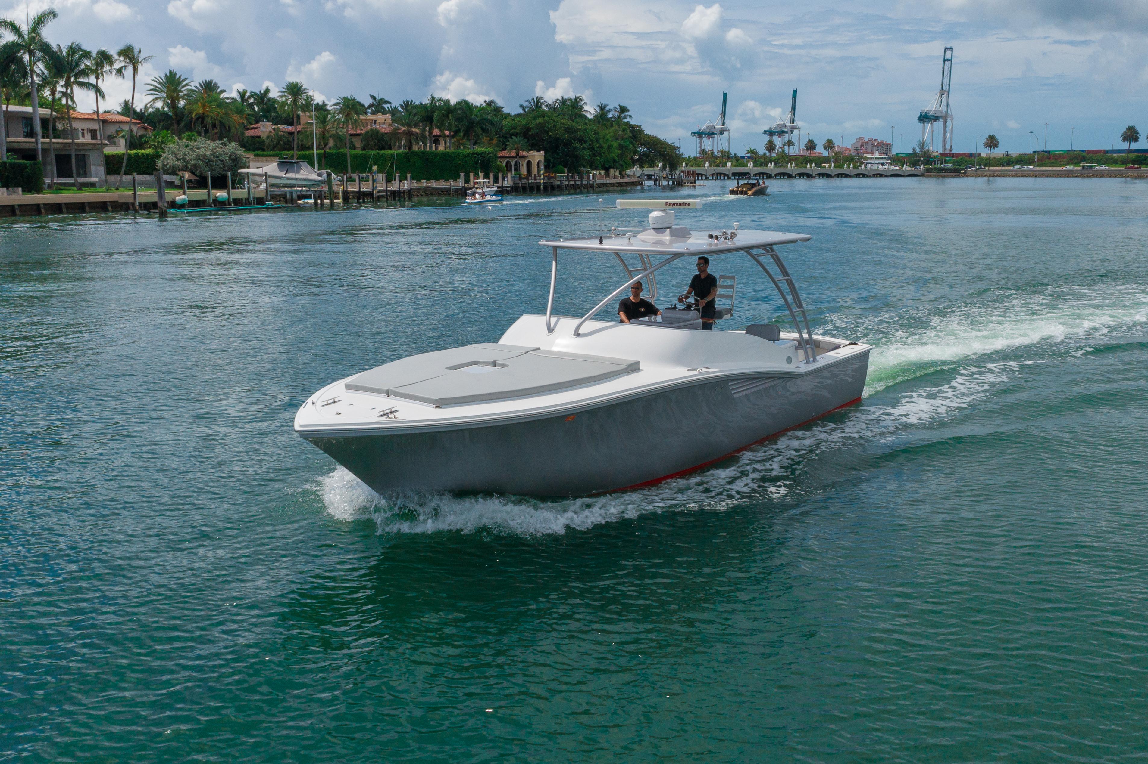 2010 Buddy Davis 35 Predator cruising on a scenic waterway.