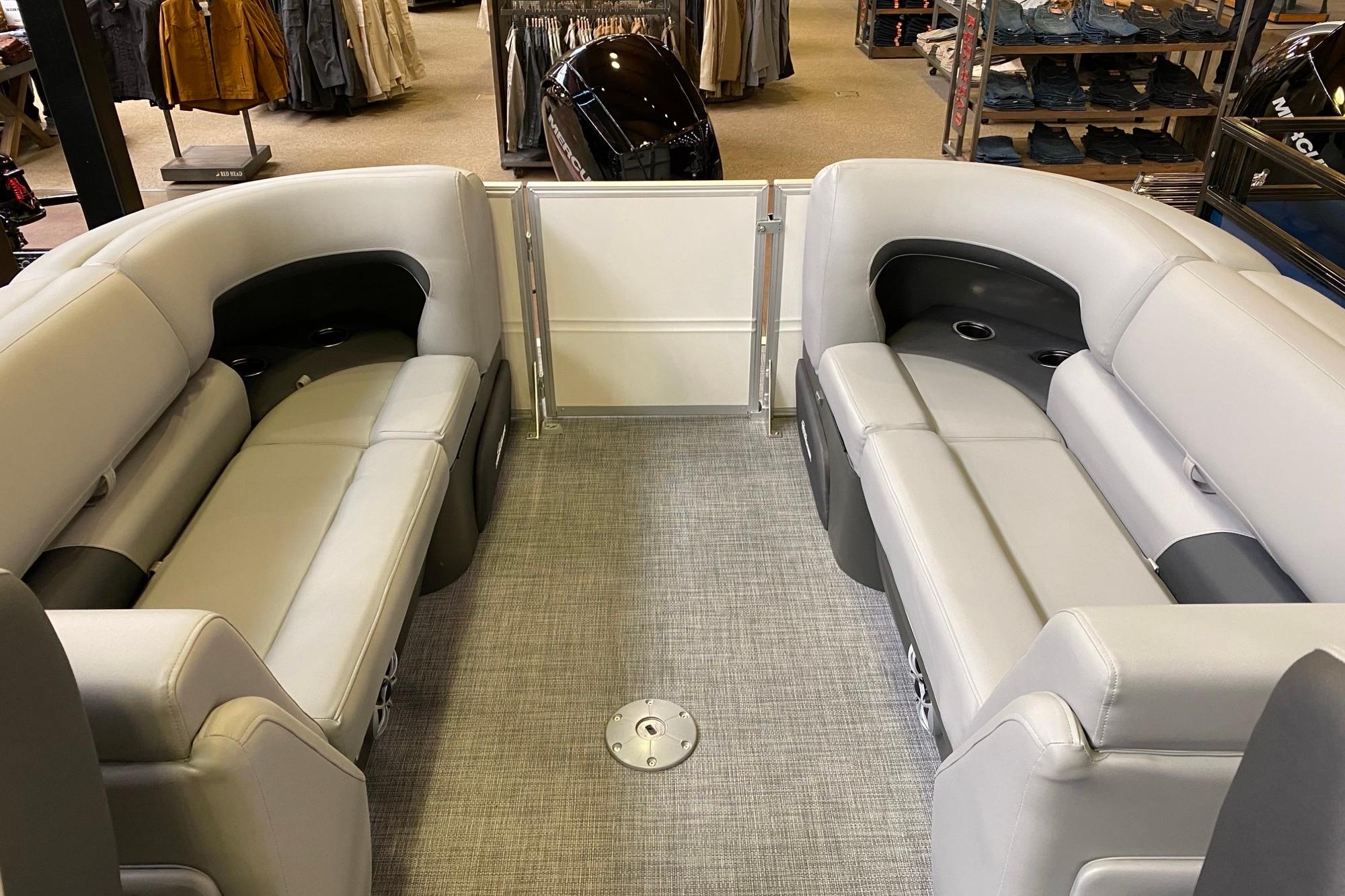2026 Sun Tracker Party Barge 22 DLX interior with plush seating and modern design.