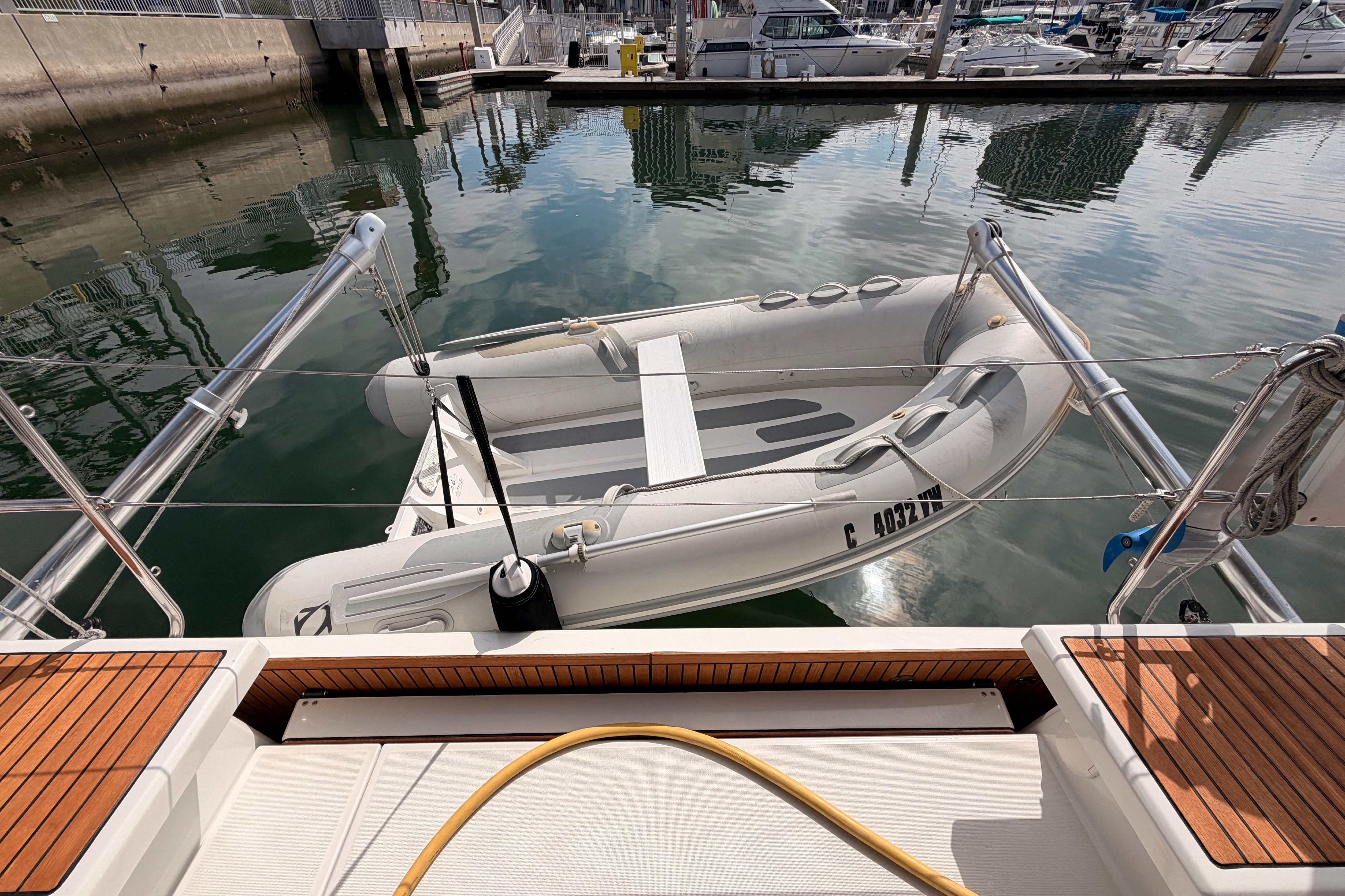 Beneteau Oceanis 46.1 (2020) with inflatable dinghy docked at marina.