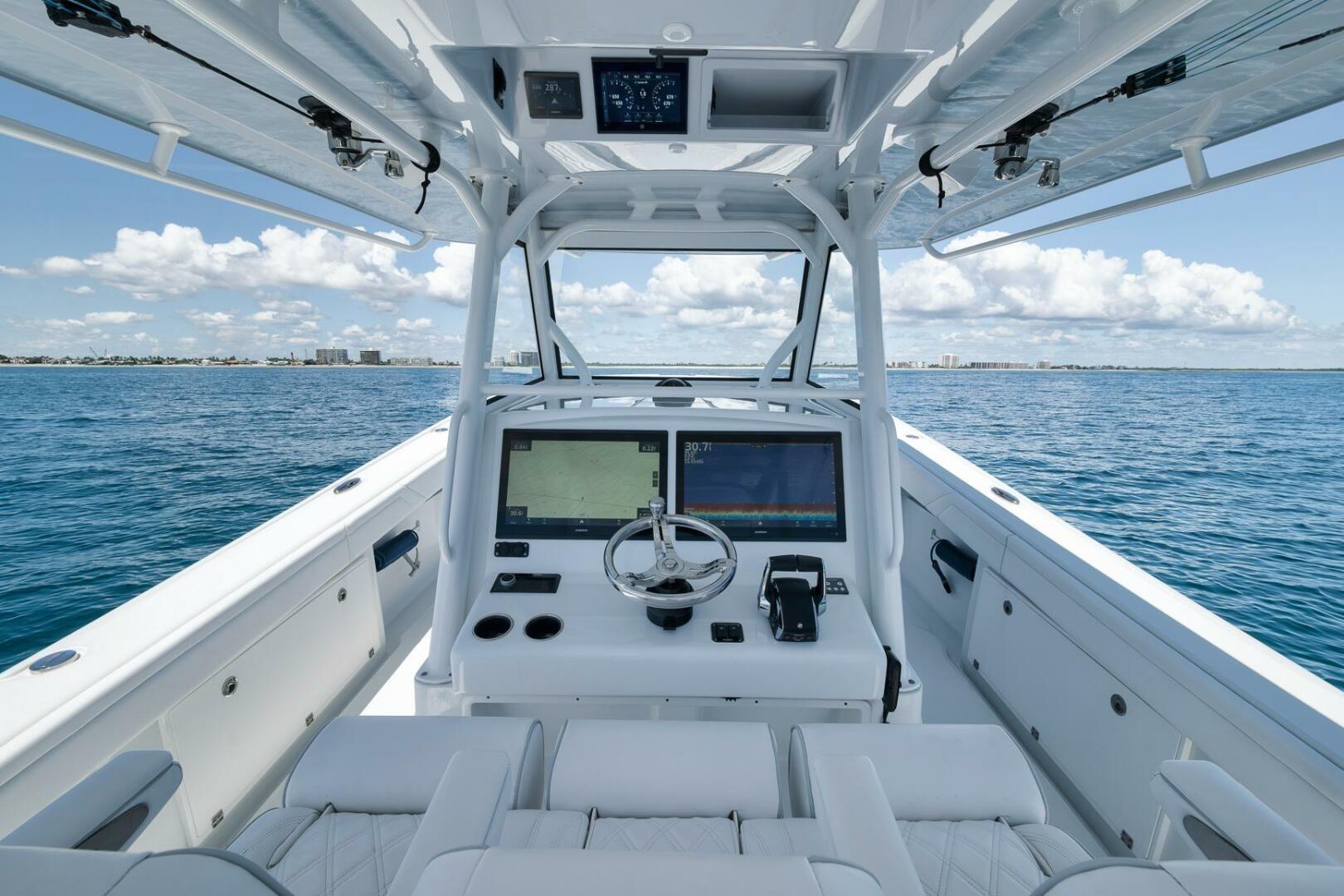 2023 Yellowfin 39 Offshore boat interior with advanced navigation system on open sea.