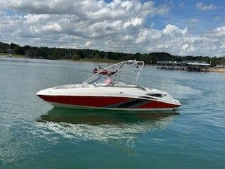 2008 Yamaha AR230 boat on calm water under cloudy sky.