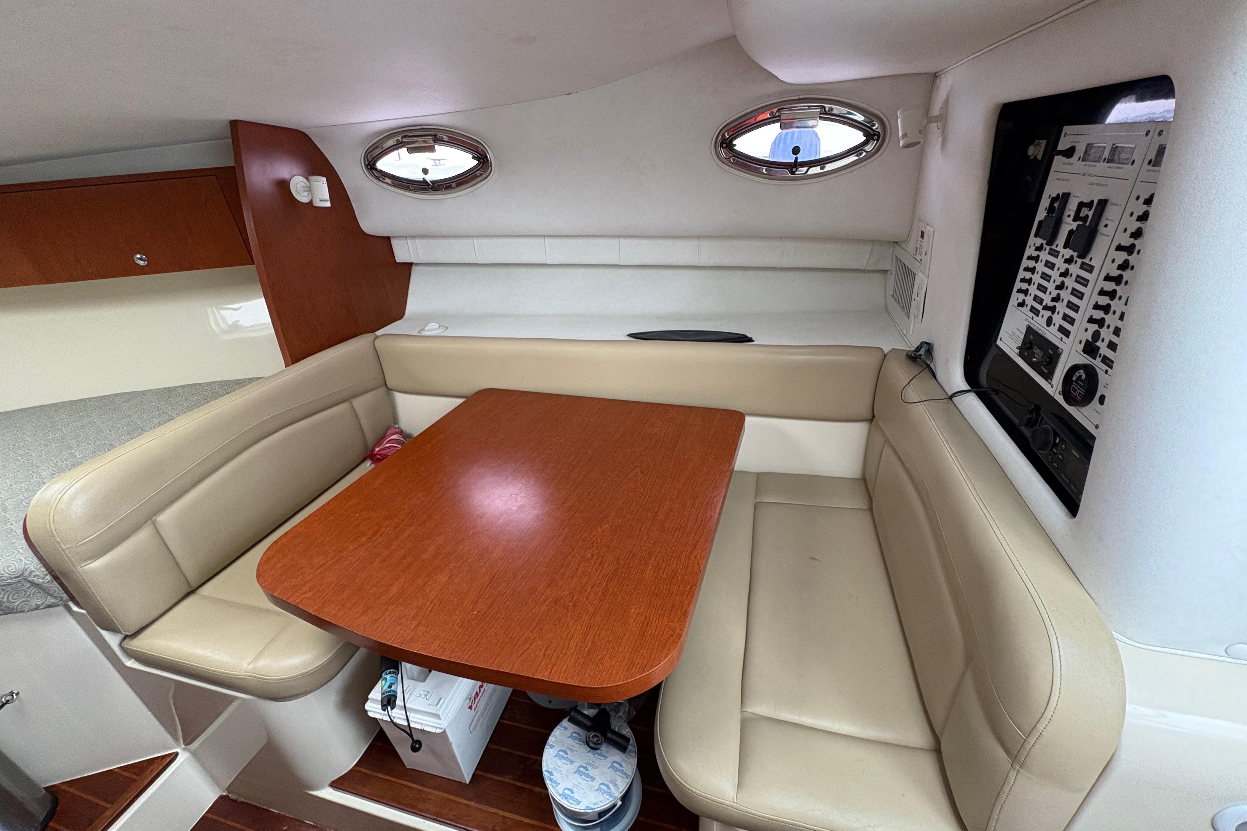 2005 Pro-Line 33 Express cabin interior with dining area and control panel.