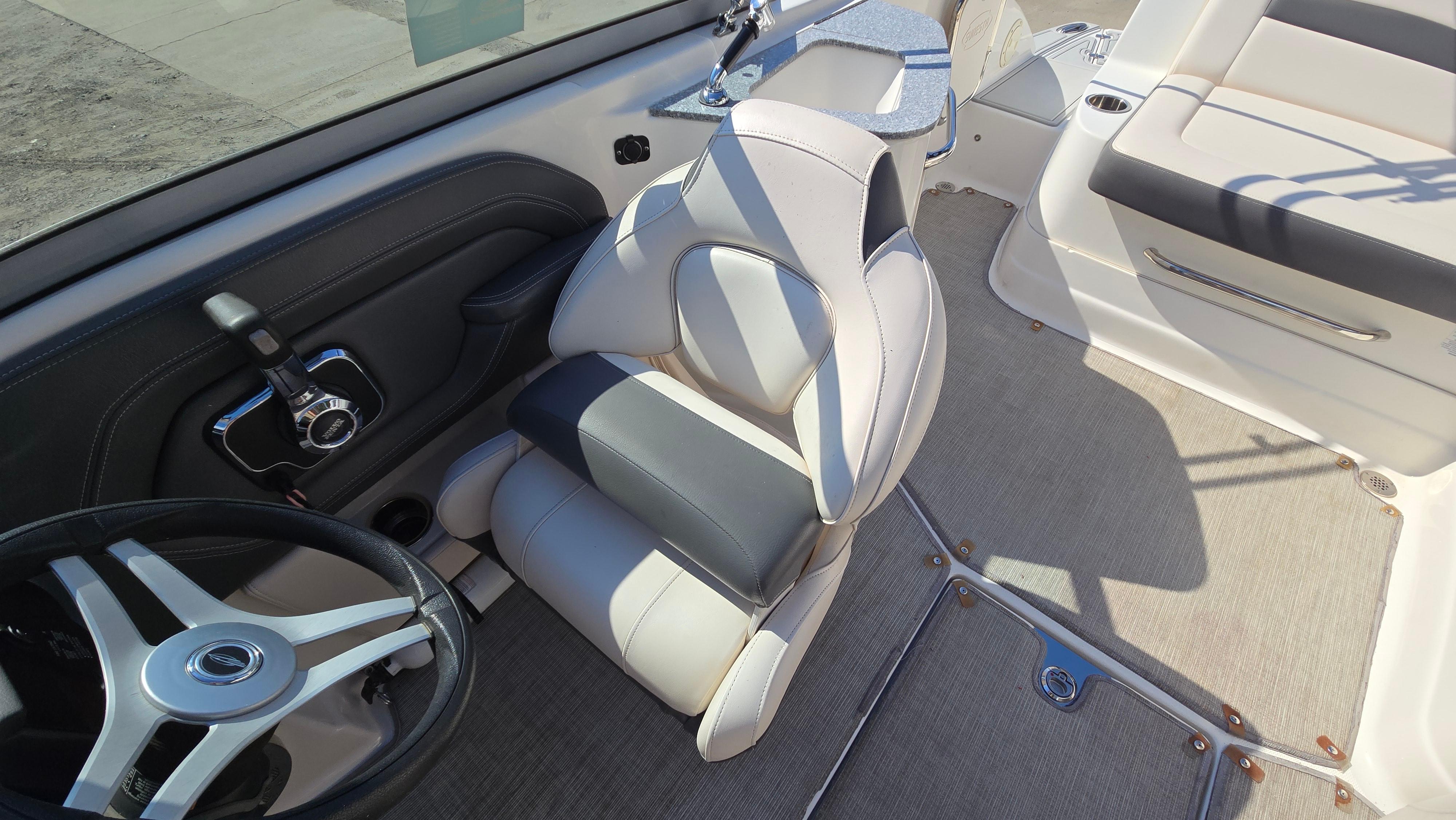 2018 Chaparral 224 Sunesta boat interior with steering wheel and seating.