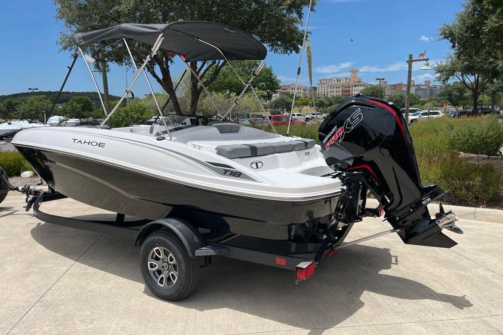 2026 Tahoe T18 boat with canopy and powerful outboard motor on a trailer.