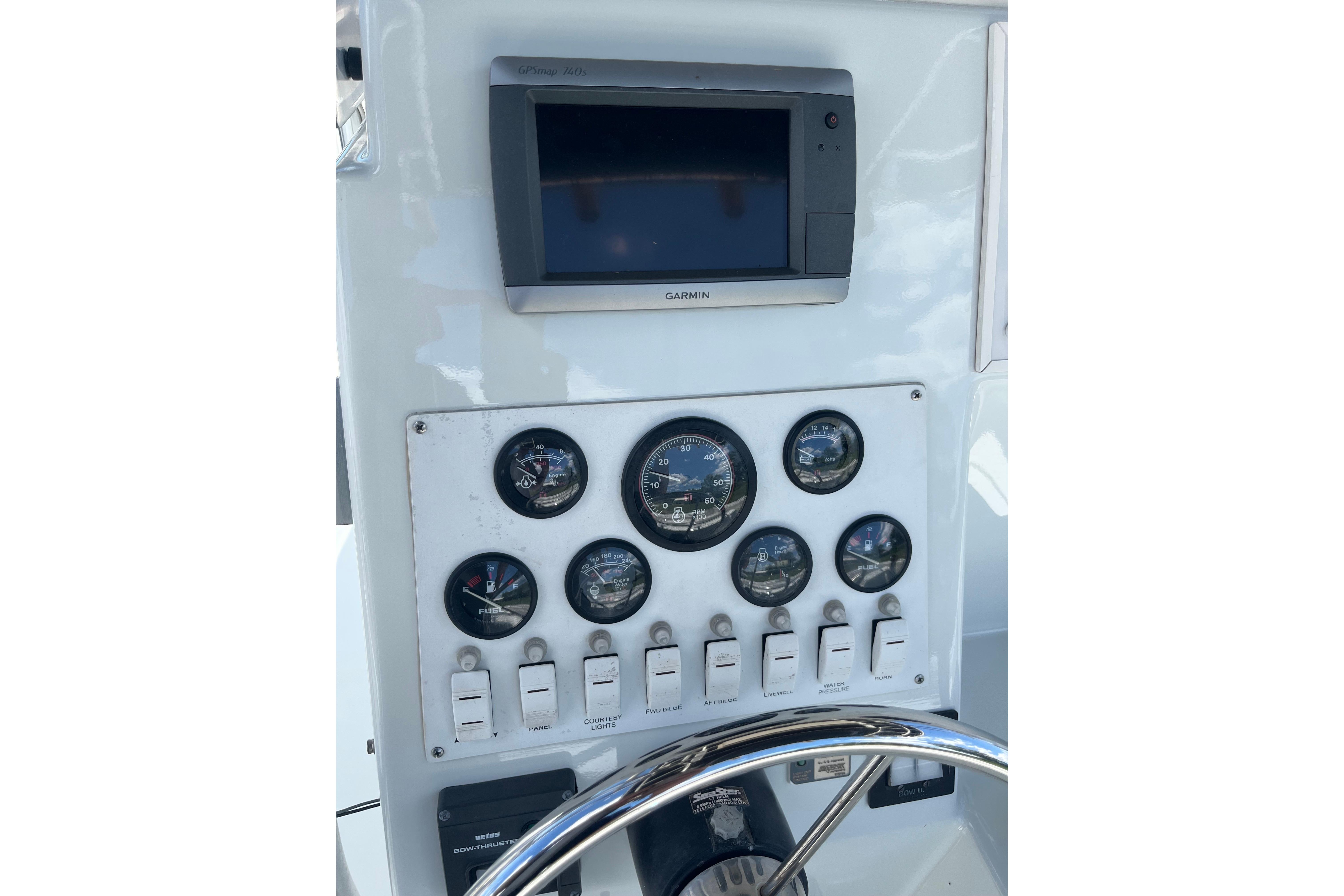 1997 Stamas boat dashboard with Garmin GPS and various gauges.