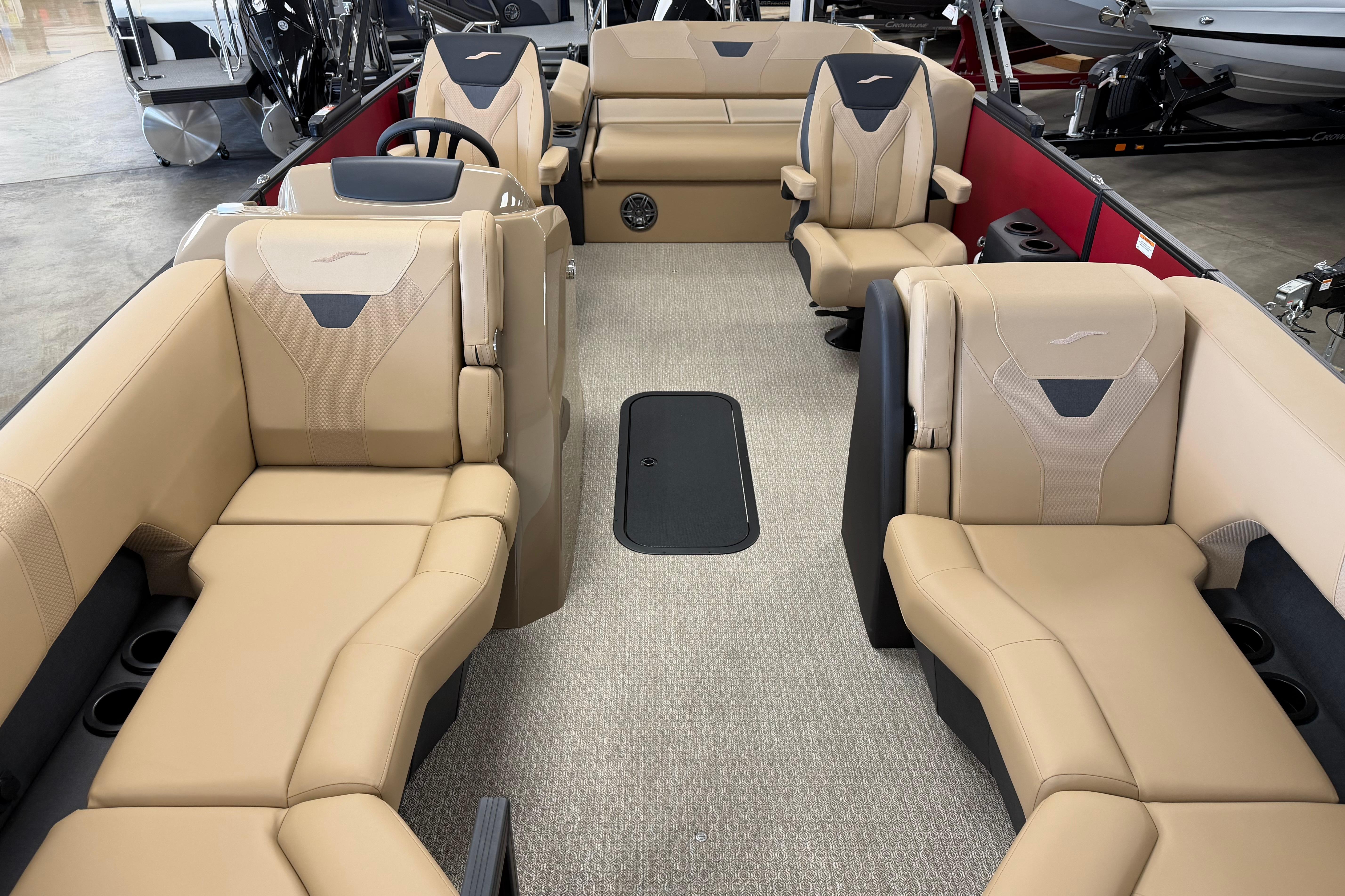Luxurious interior of 2026 Evotti 523CS boat with beige seating and modern design.
