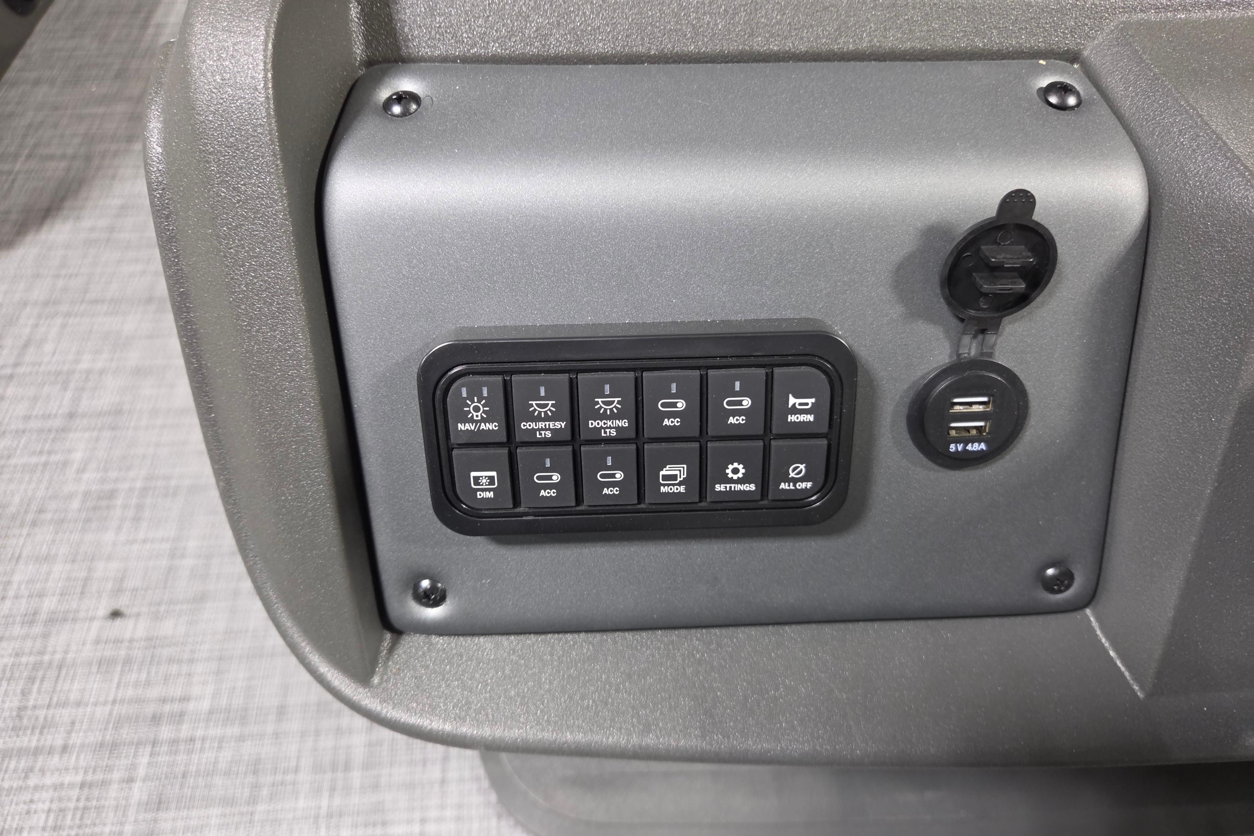 Control panel of 2026 Sun Tracker Party Barge 20 DLX with USB ports and switches.