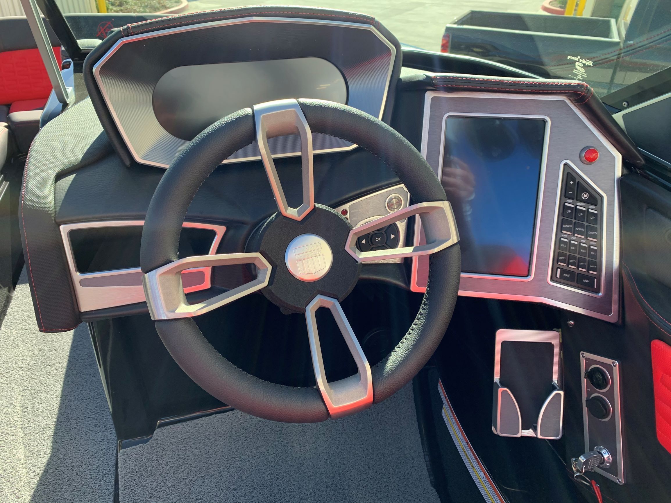 The image shows the helm of a 2020 MasterCraft X24 with modern controls.