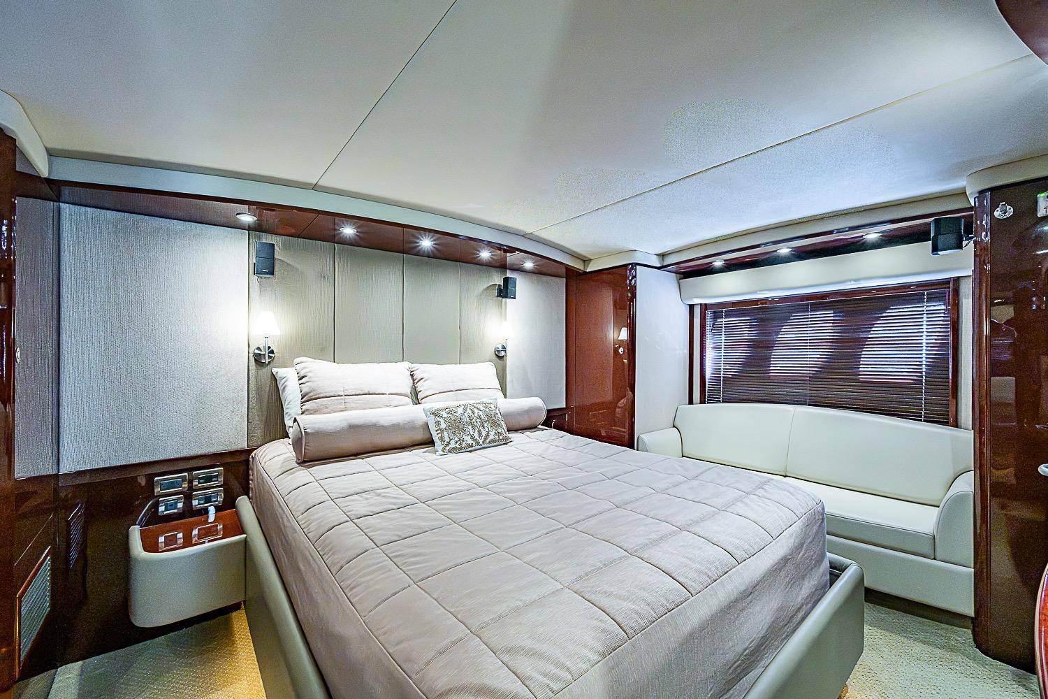 Luxurious bedroom interior of 2008 Sea Ray 60 Sundancer yacht with elegant furnishings.