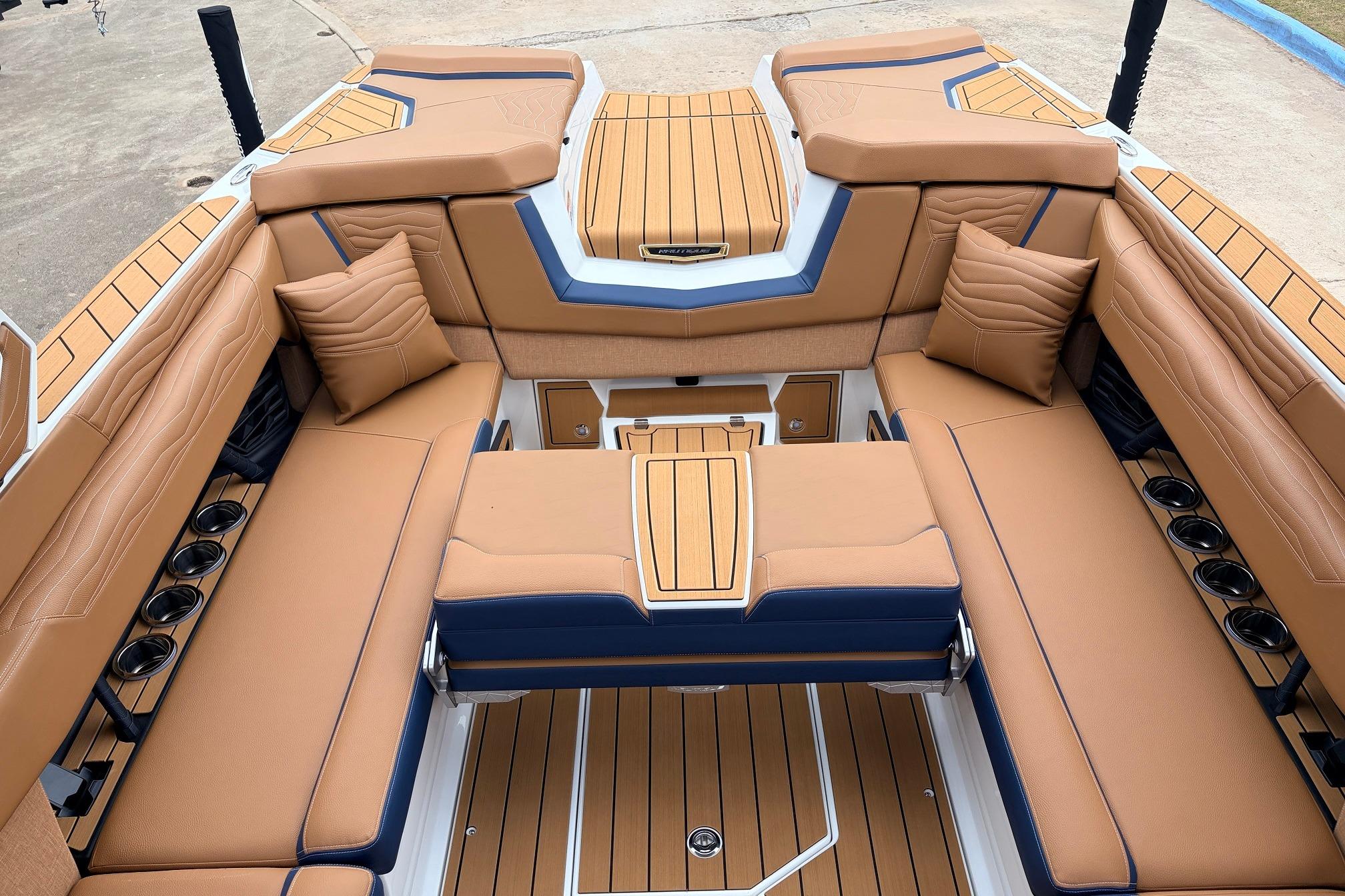 Luxurious interior of 2026 Nautique Super Air Nautique G25 boat with tan seating.