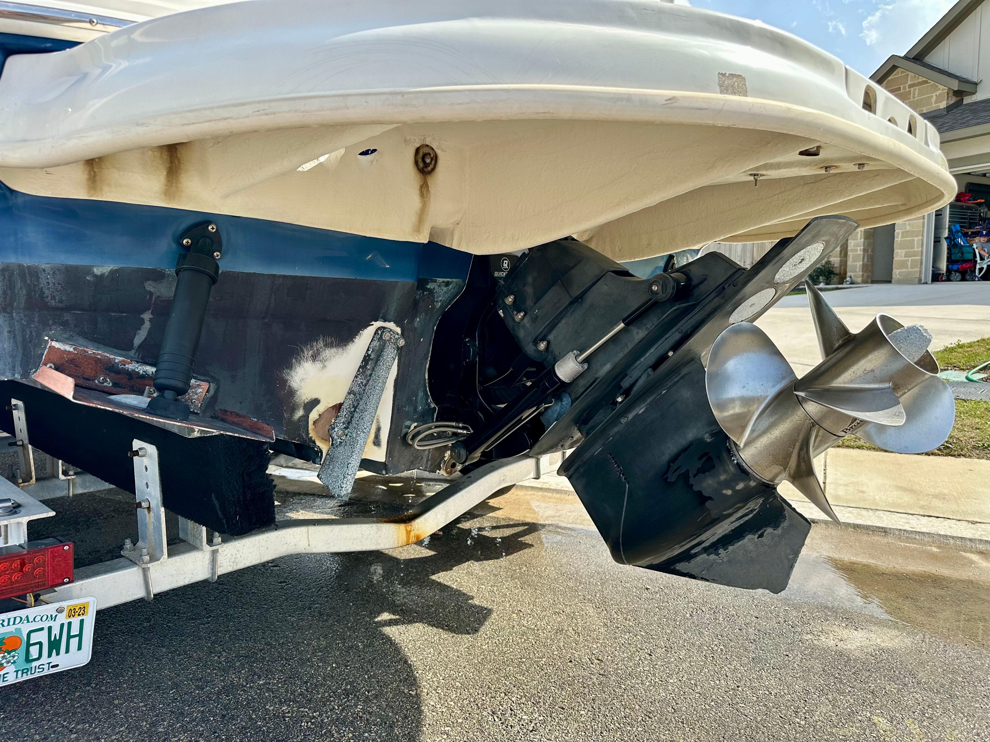 Rear view of a 2006 Sea Ray 240 Sundeck boat on a trailer.