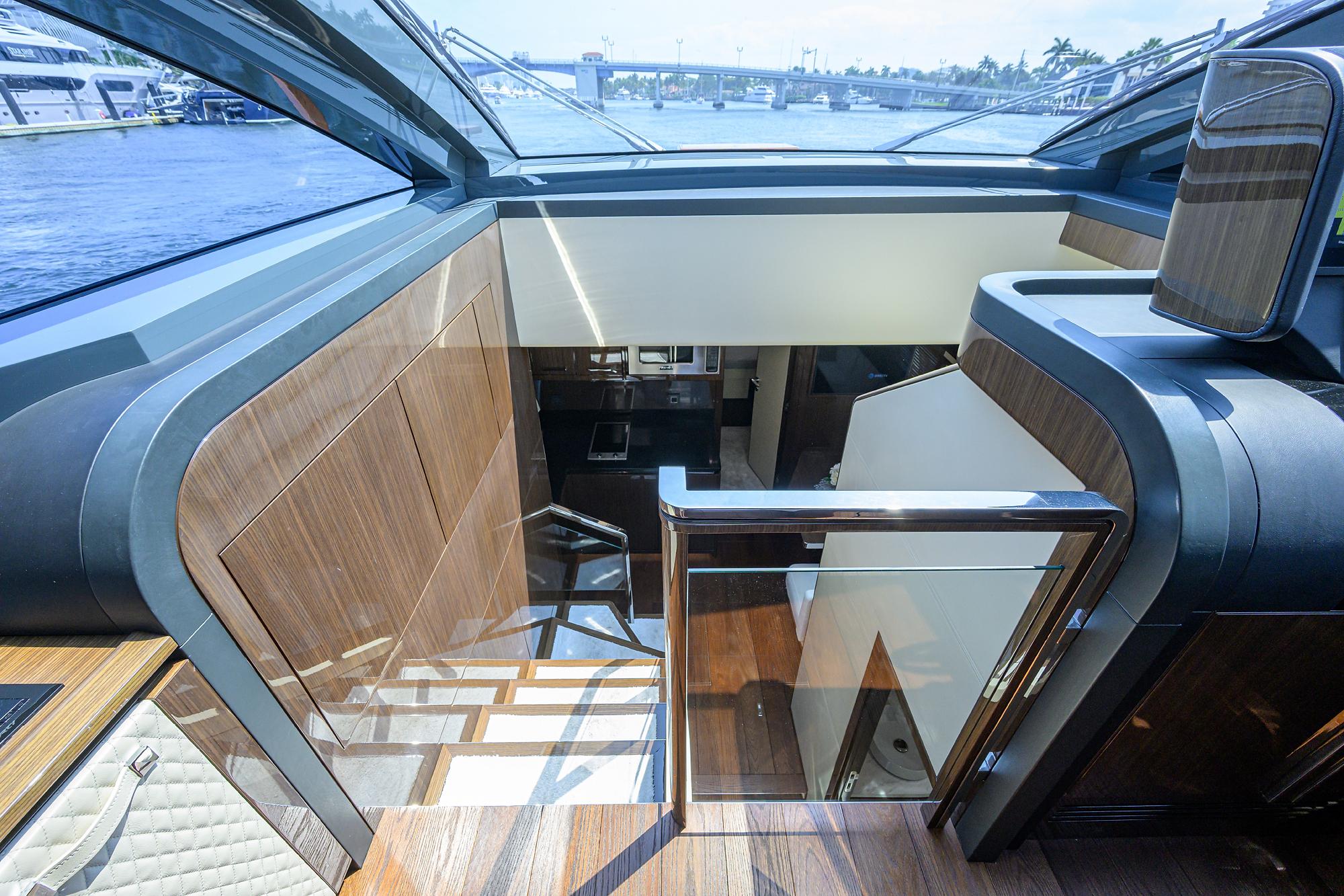 2023 Lazzara LSX 67 yacht interior with modern wood and glass design.