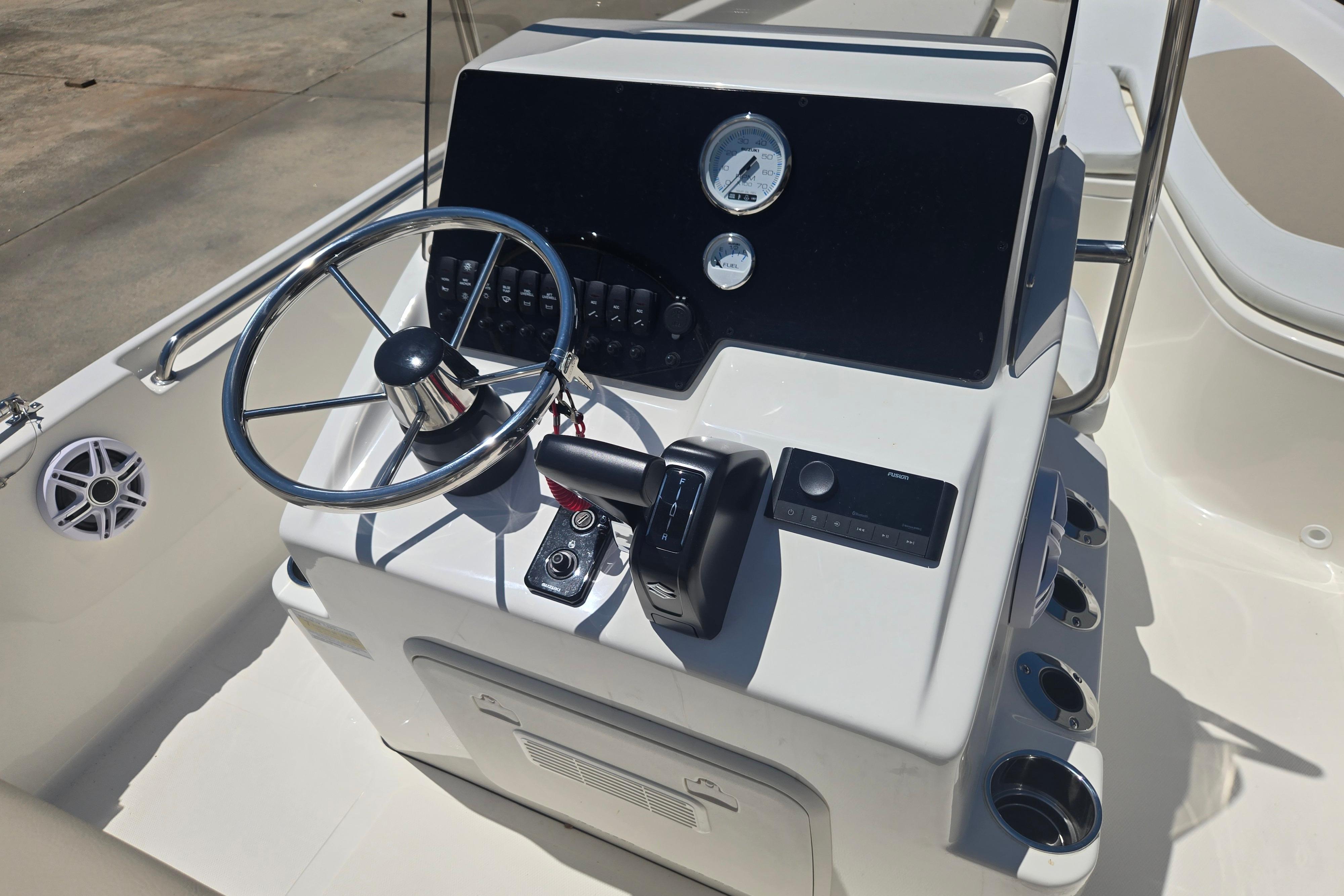 Steering console of a 2026 Bulls Bay 2000 boat with modern controls and gauges.