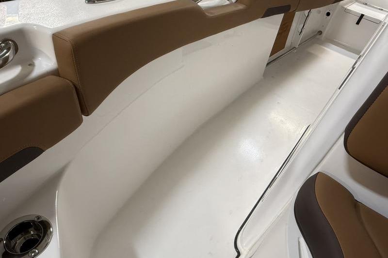 2026 Sea Pro 242 Center Console interior with brown seating and white deck.