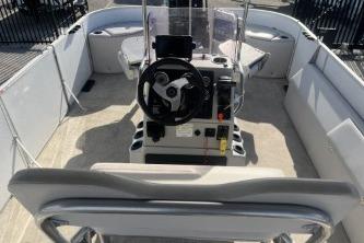 2023 Suntracker G3 Select 322 CC boat interior with steering console and seating.