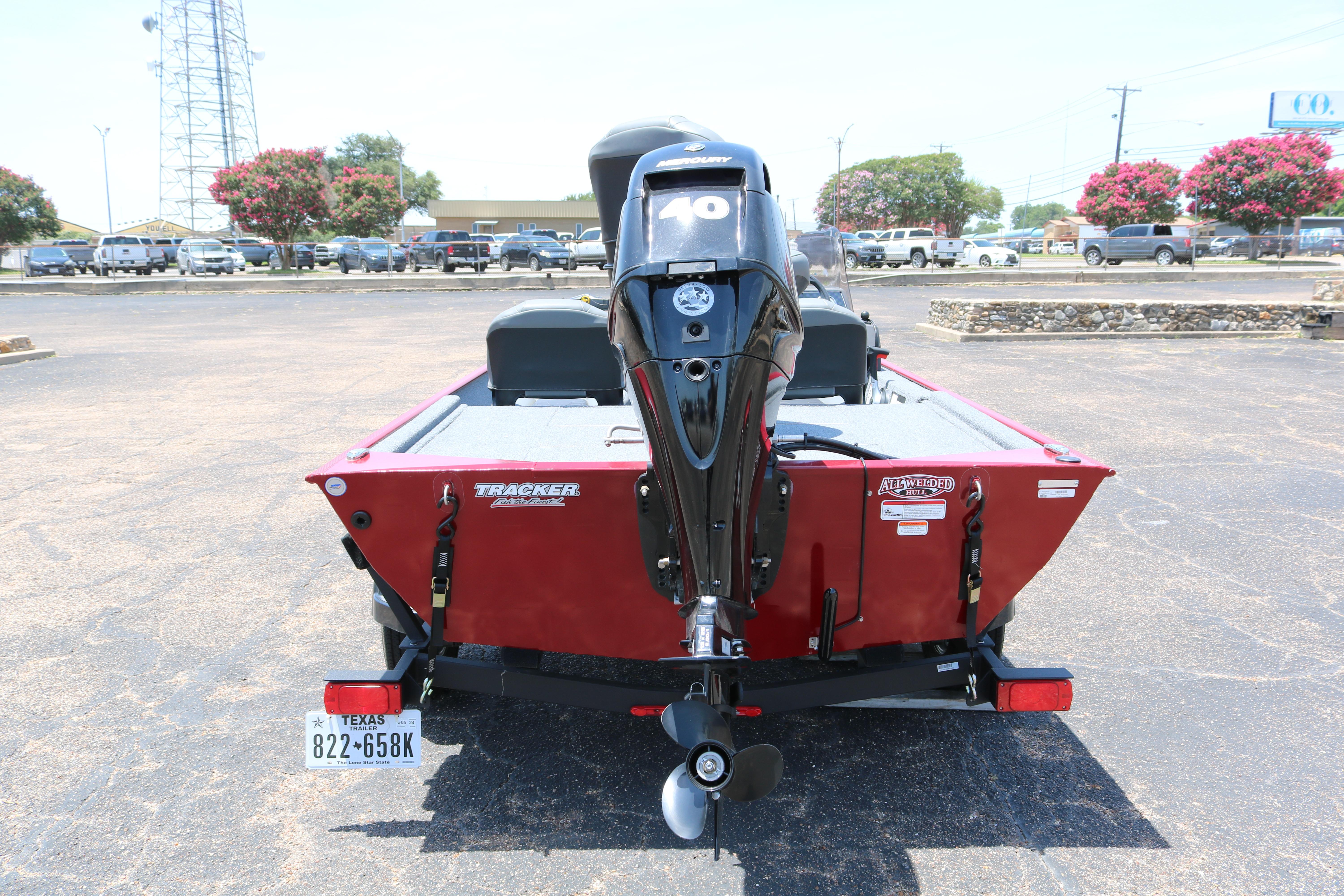 2021 Tracker Bass Tracker Classic XL boat with Mercury engine, parked outdoors.