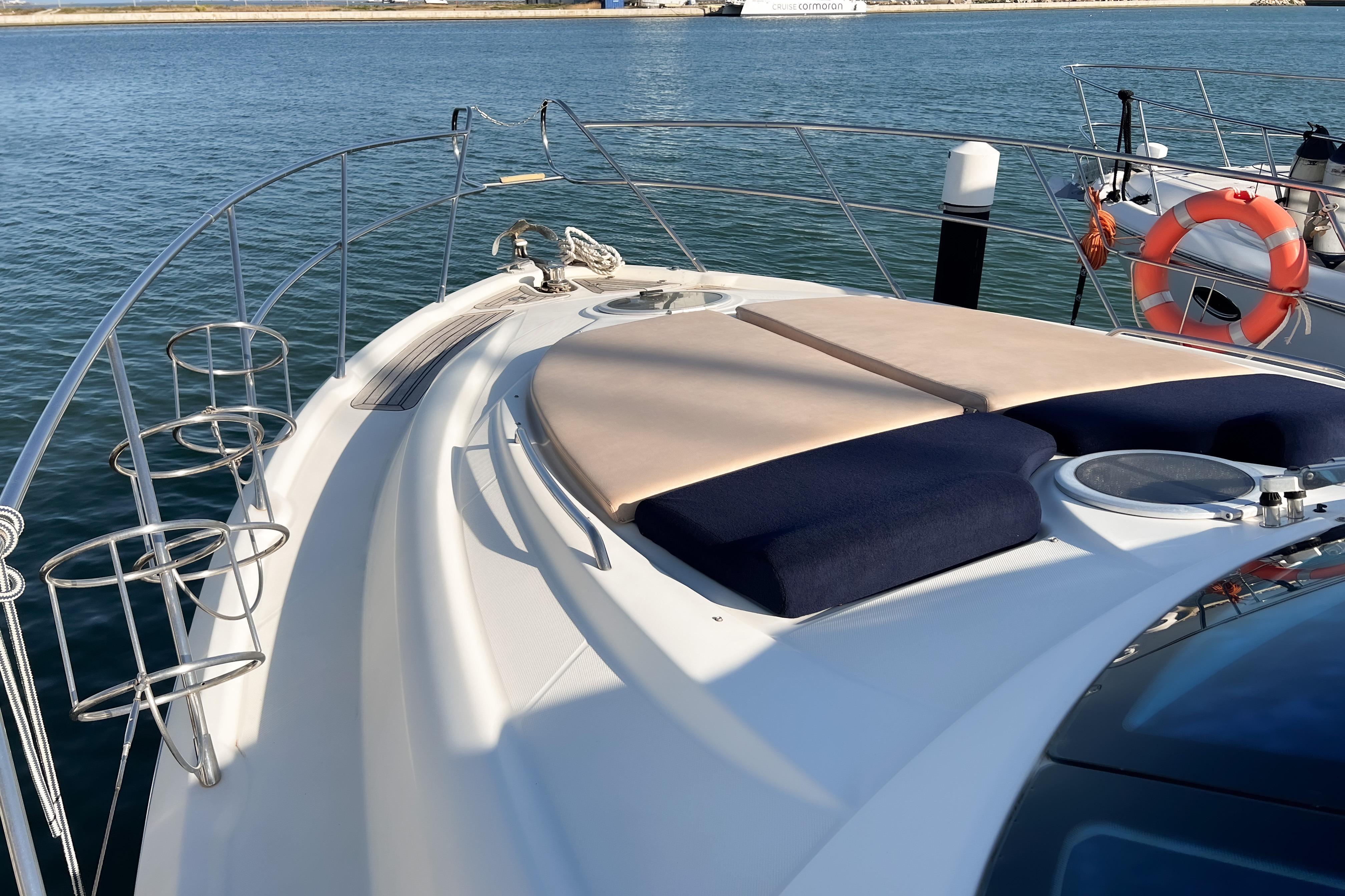 2009 Chranchy Cranchi Mediterranée 43 HT yacht with sunbathing cushions on deck.