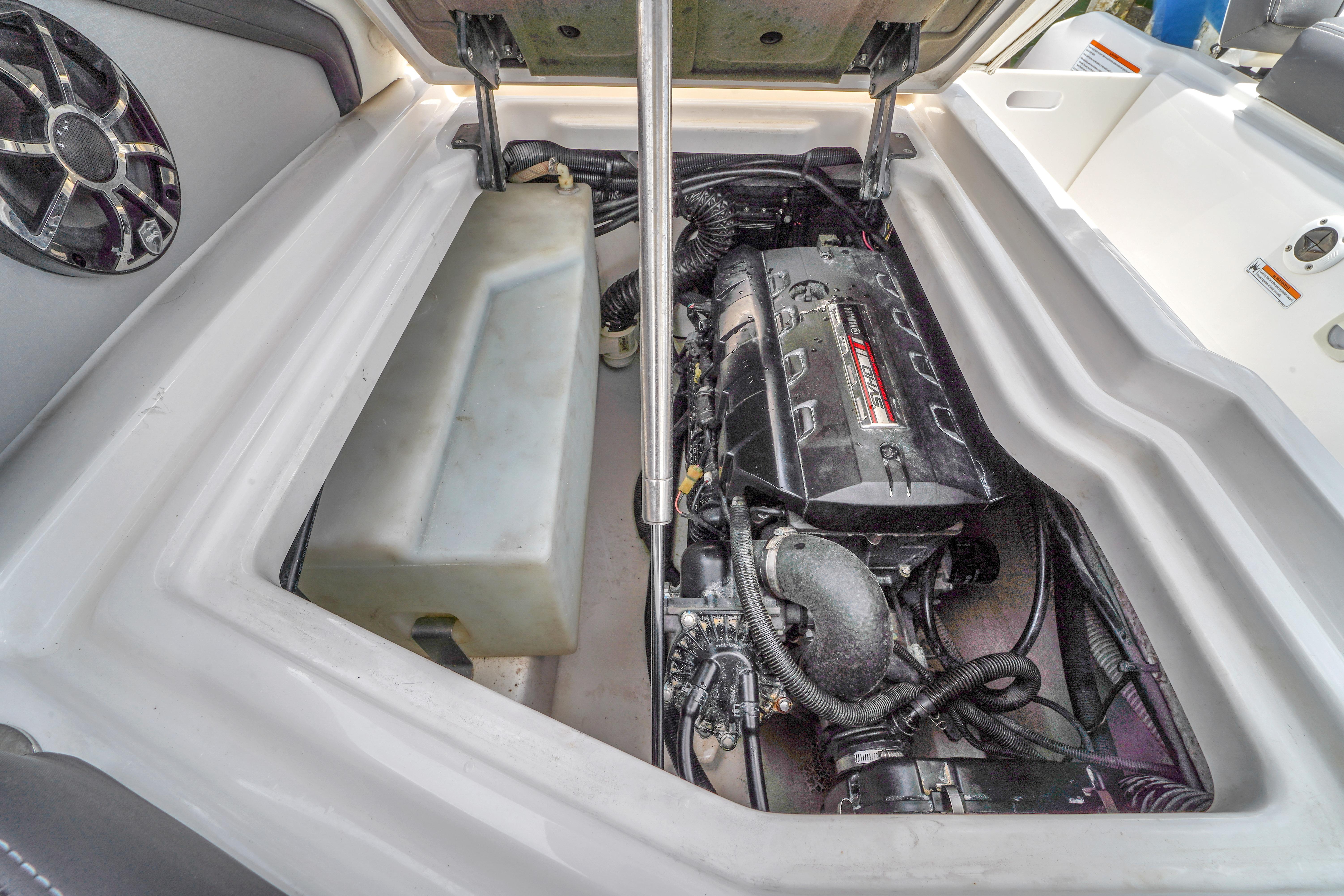 Engine compartment of 2021 Yamaha Boats 275SD, showcasing internal components and design.