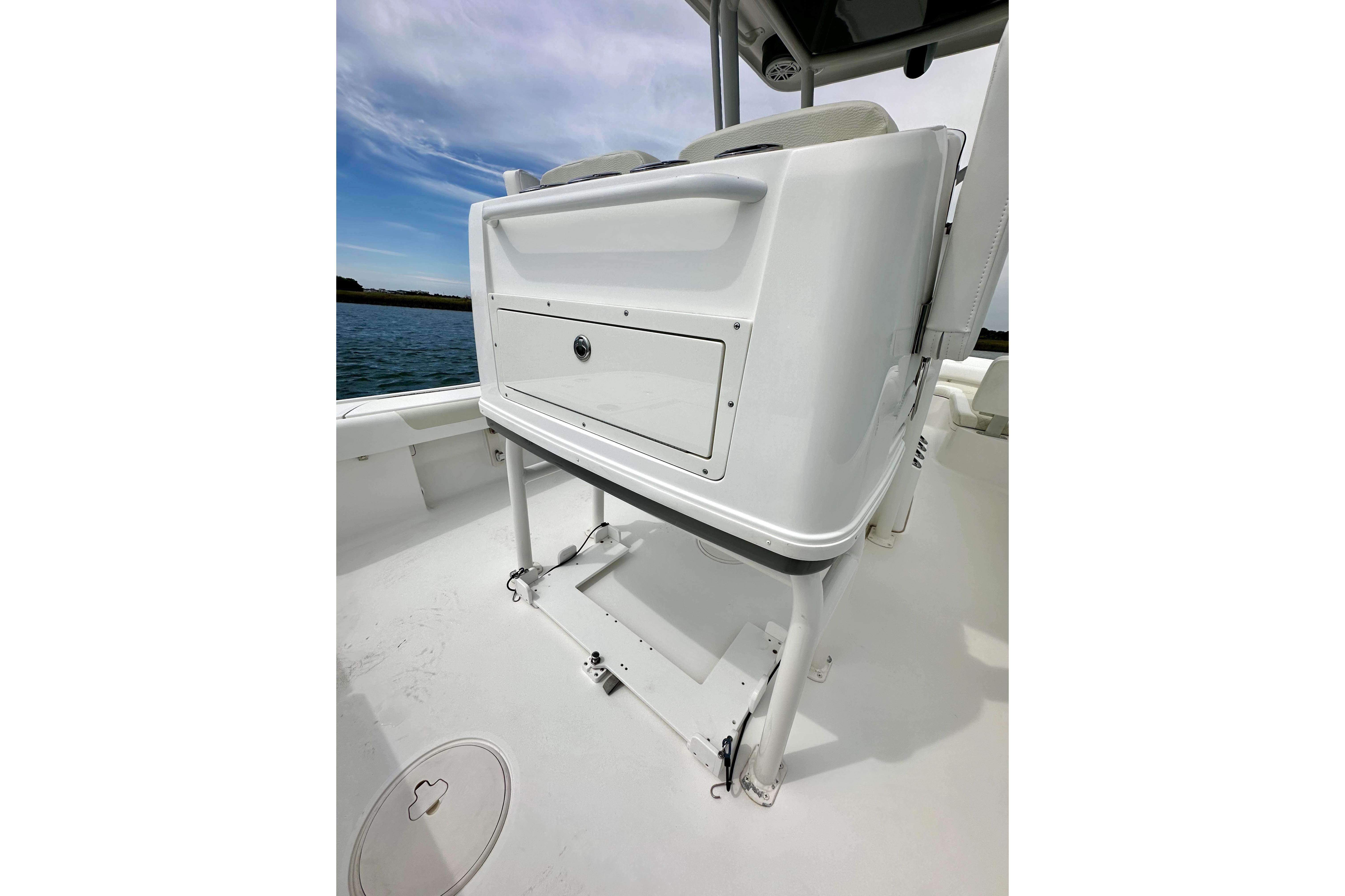 2020 Caymas 26 HB boat interior with storage compartment and seating.