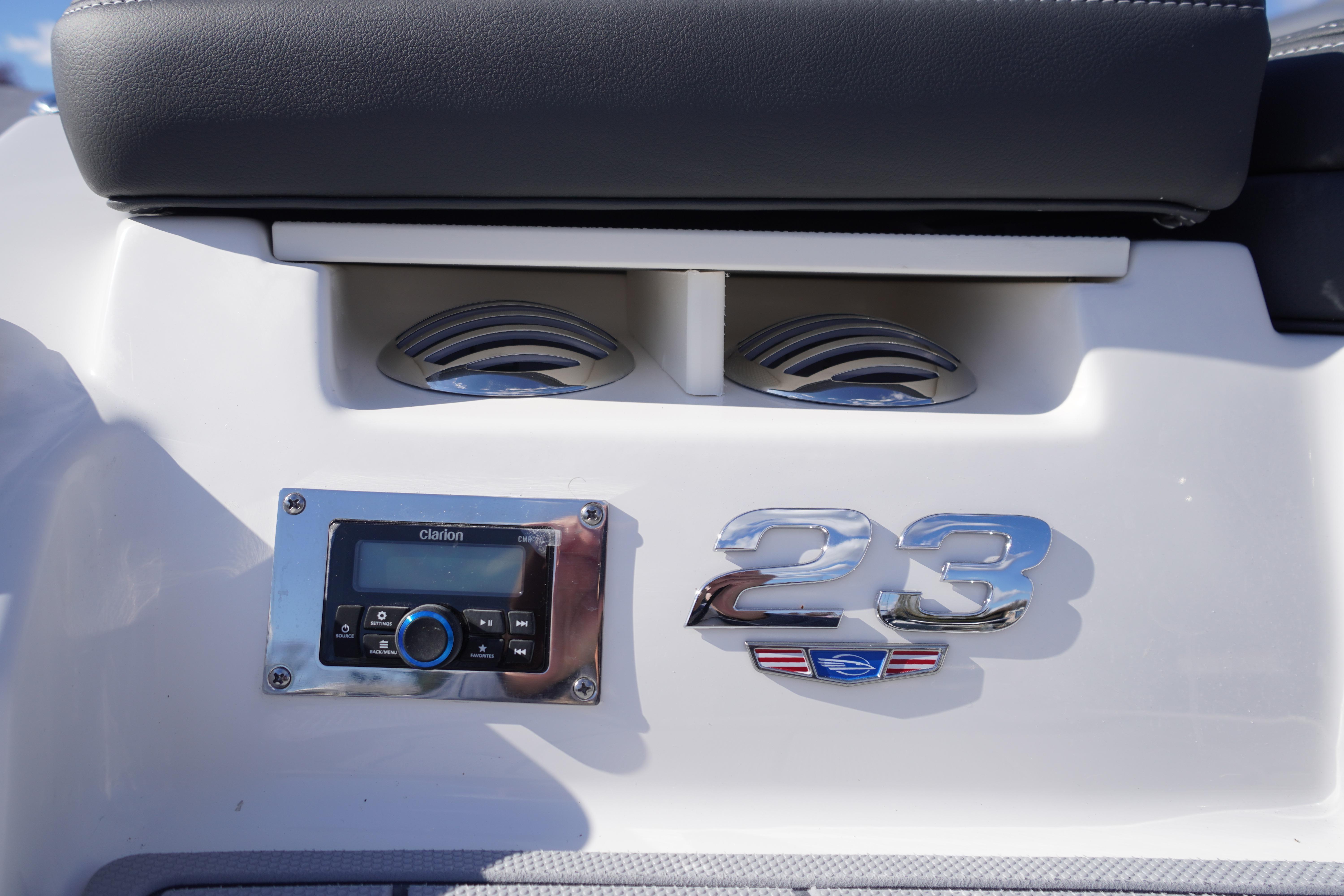 2026 Chaparral 23 SSi OB boat dashboard with Clarion stereo system.