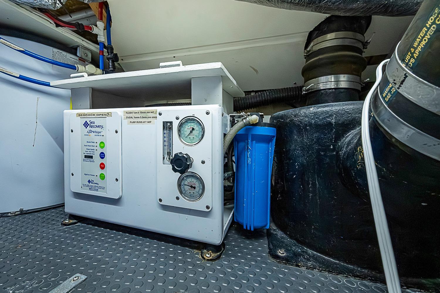 Marine engine room of 2003 Magna Marine Nova Scotia 47, featuring Sea Recovery system.